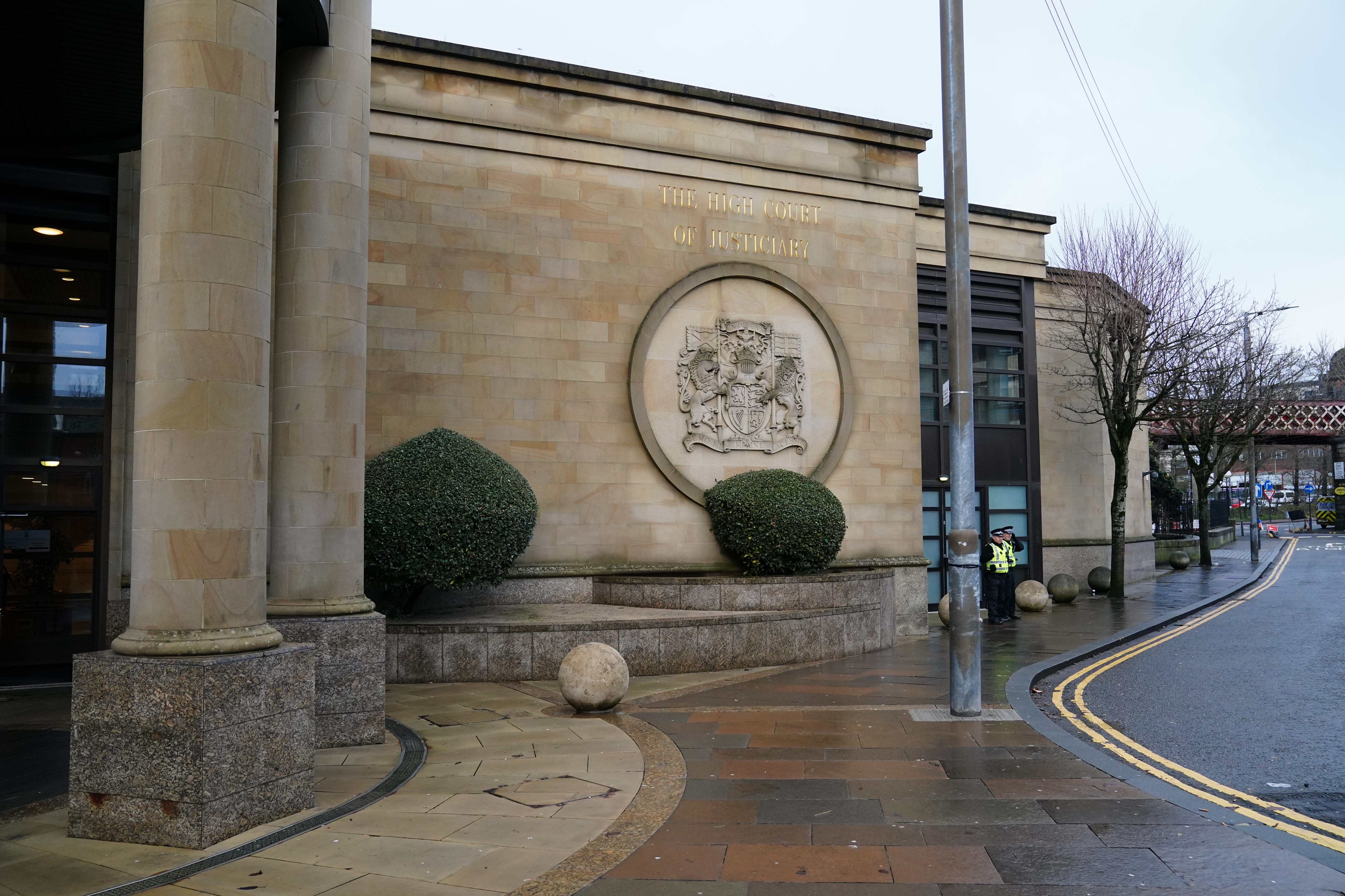 The trial is taking place at the High Court in Glasgow (PA)