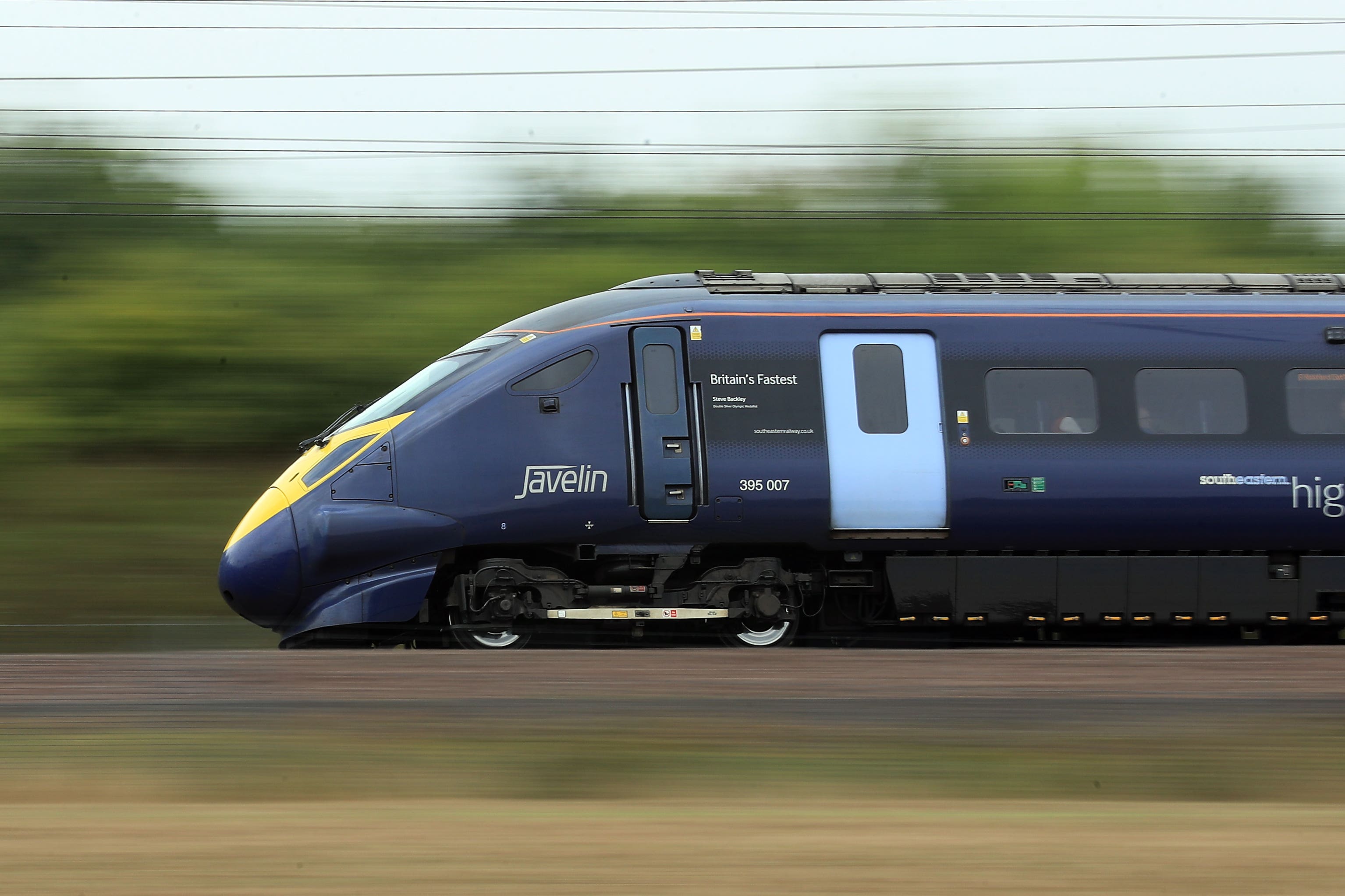 A Hitachi Javelin high speed train passes through Ashford, Kent. Maintenance workers at three sites will strike for five days over pay (Gareth Fuller/PA)