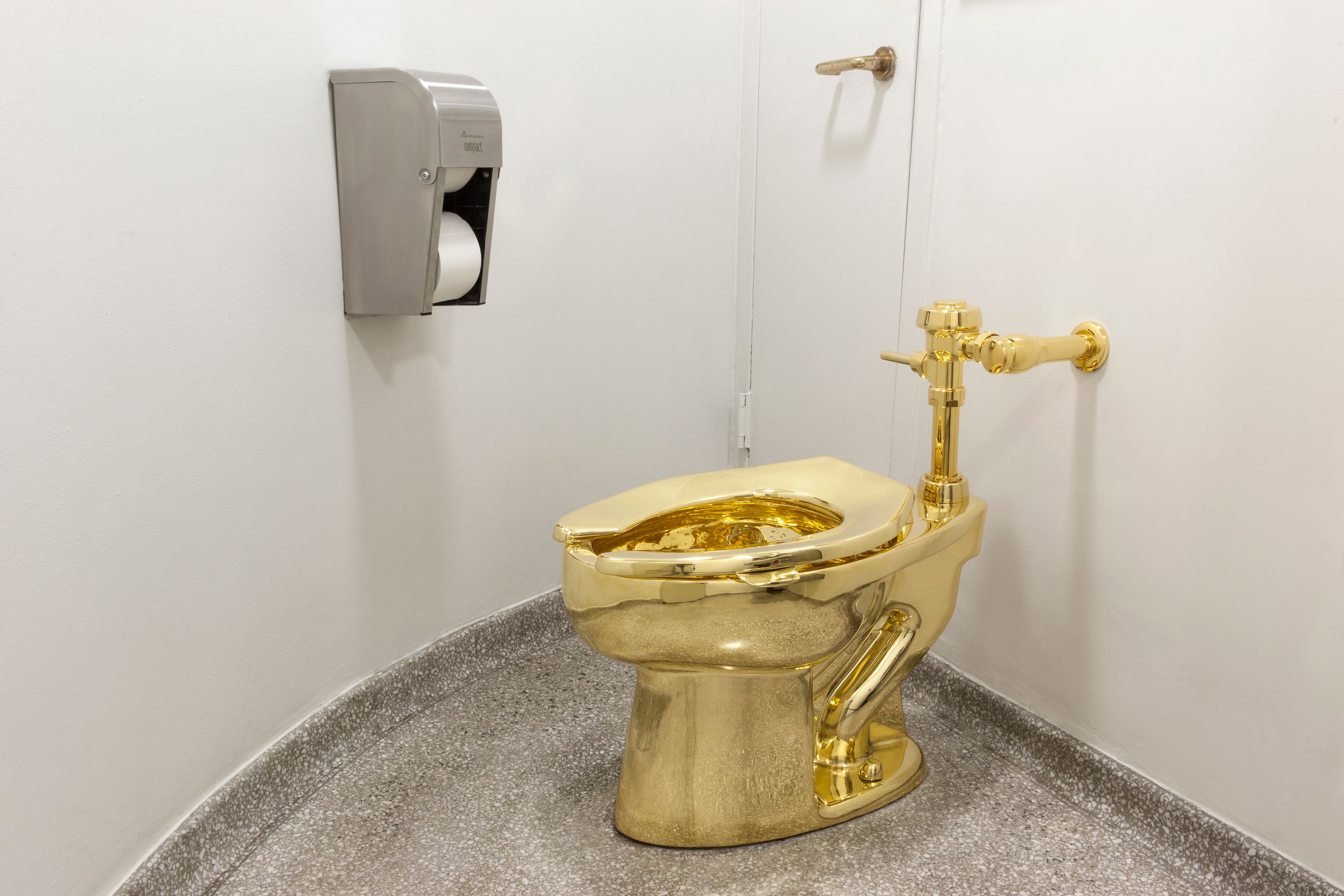 The fully functioning toilet, titled America, was created by Italian artist Maurizio Cattelan and housed in the Oxfordshire country house where Sir Winston Churchill was born (Blenheim Palace/PA)