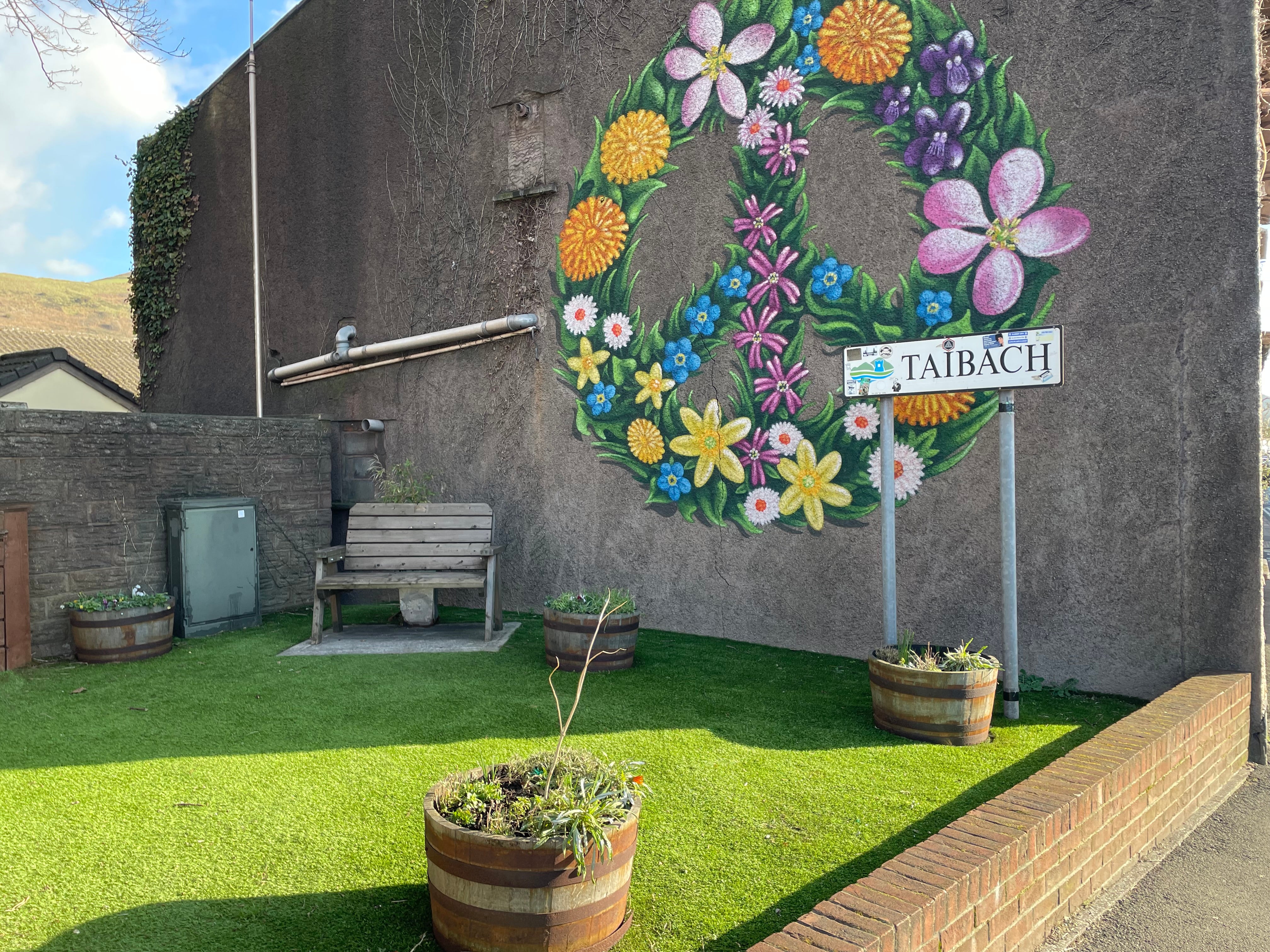 A community garden has been created on the road next to the entrance to Taibach, which sits in the shadow of the steelworks