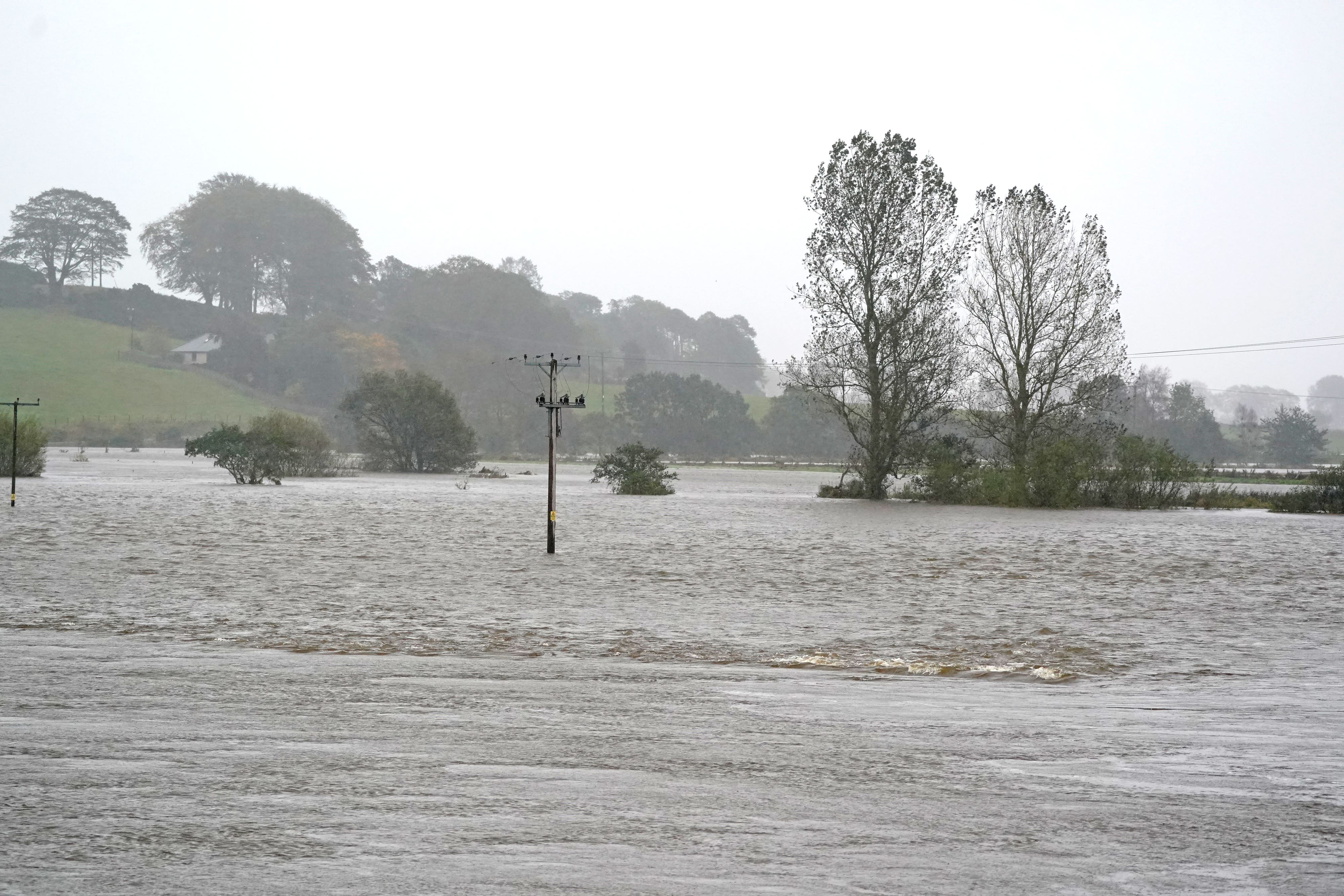 Strong winds and rain sweeping in with Storm Isha could result in floods (PA)