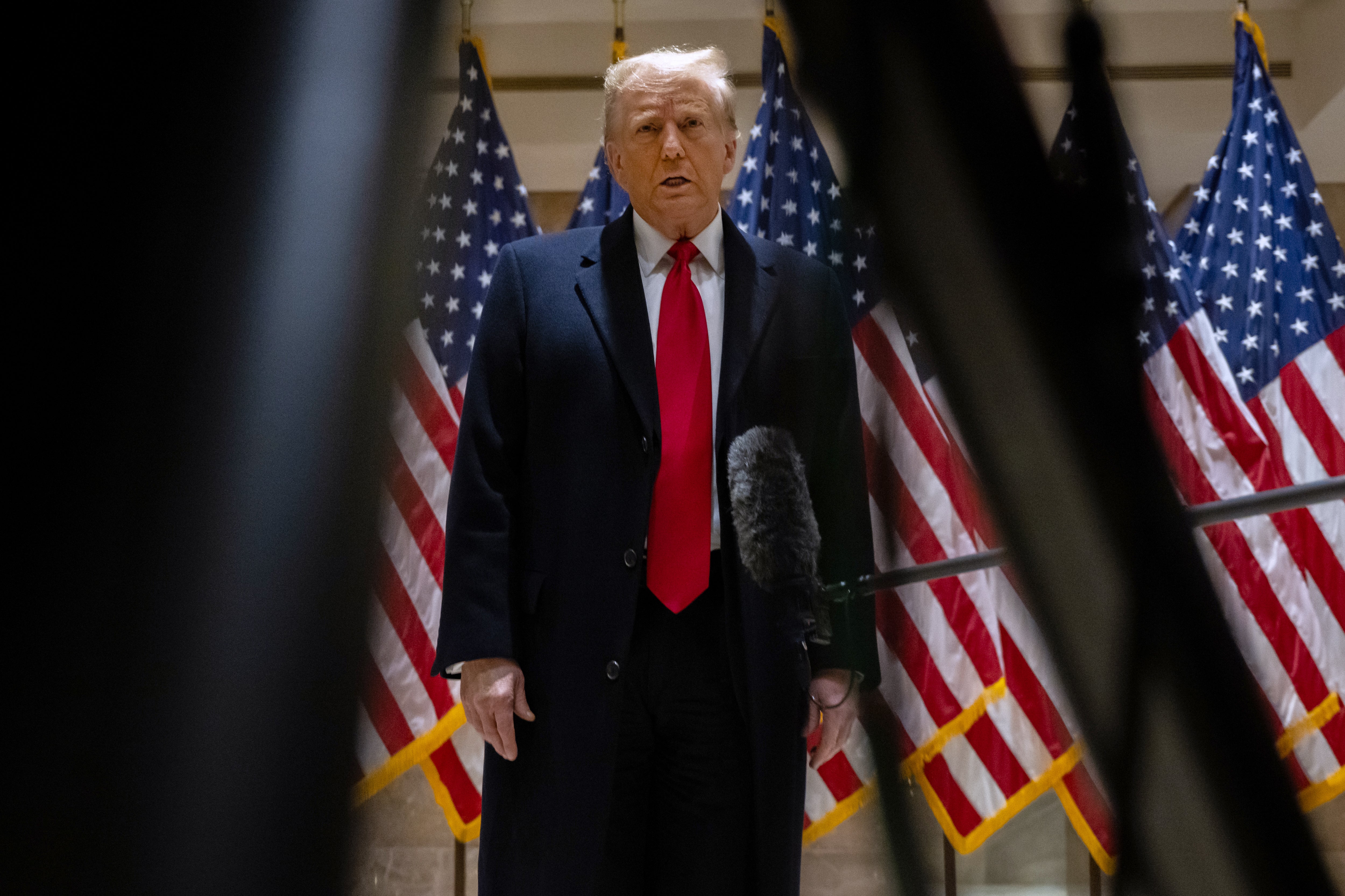 Donald Trump speaks to reporters after appearing in federal court for a defamation lawsuit on 17 January.