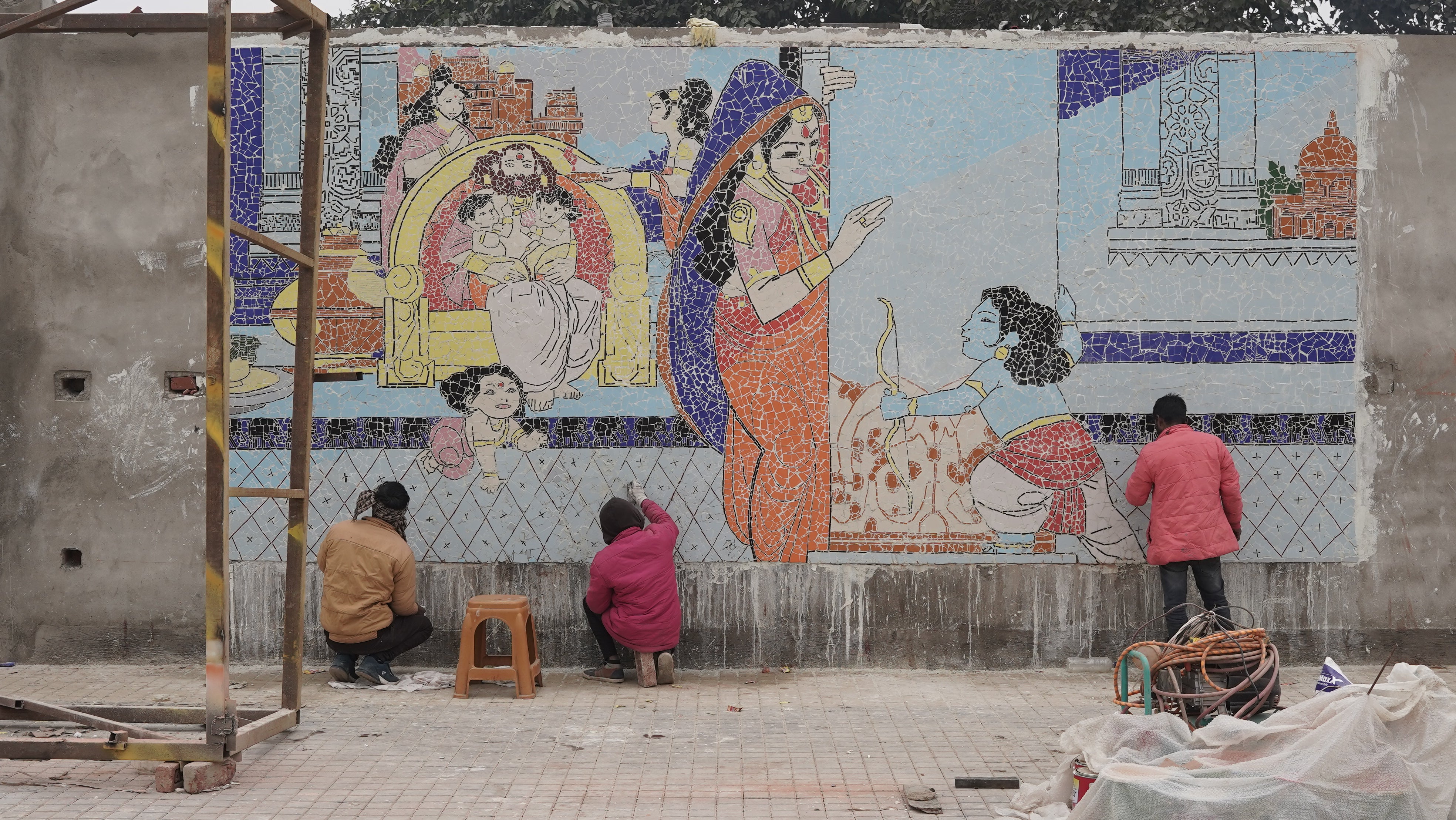 Artists working to beautify the streets of Ayodhya as they visually reimagine the childhood of Lord Ram