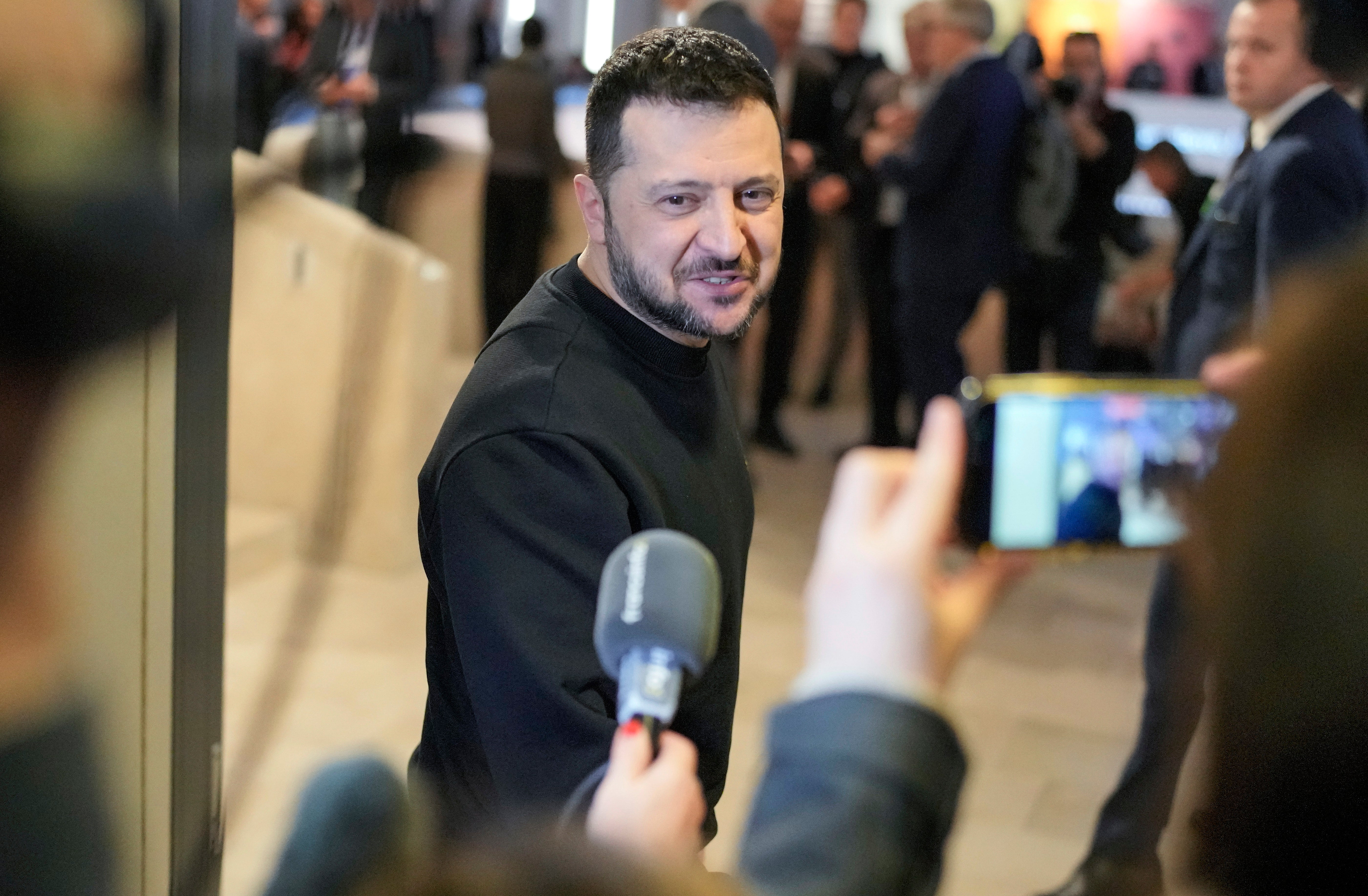 Ukrainian President Volodymyr Zelenskyy talks to reporters after a meeting at the Annual Meeting of World Economic Forum in Davos