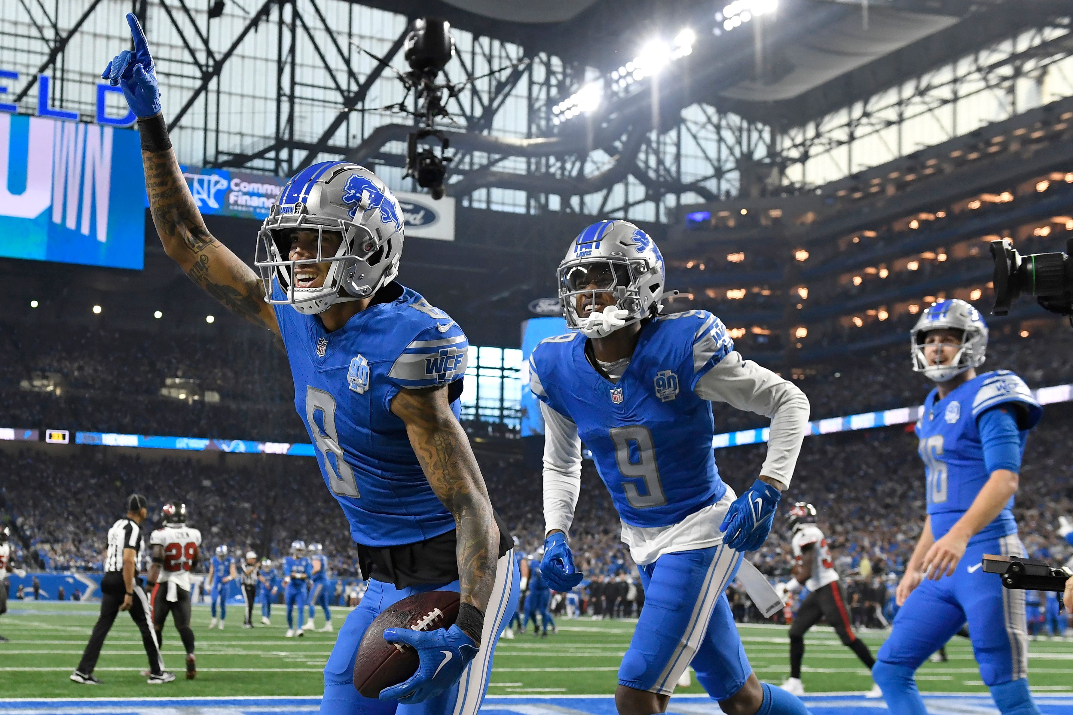 Detroit Lions wide receiver Josh Reynolds celebrates with Jameson Williams and Jared Goff (Jose Juarez/AP)