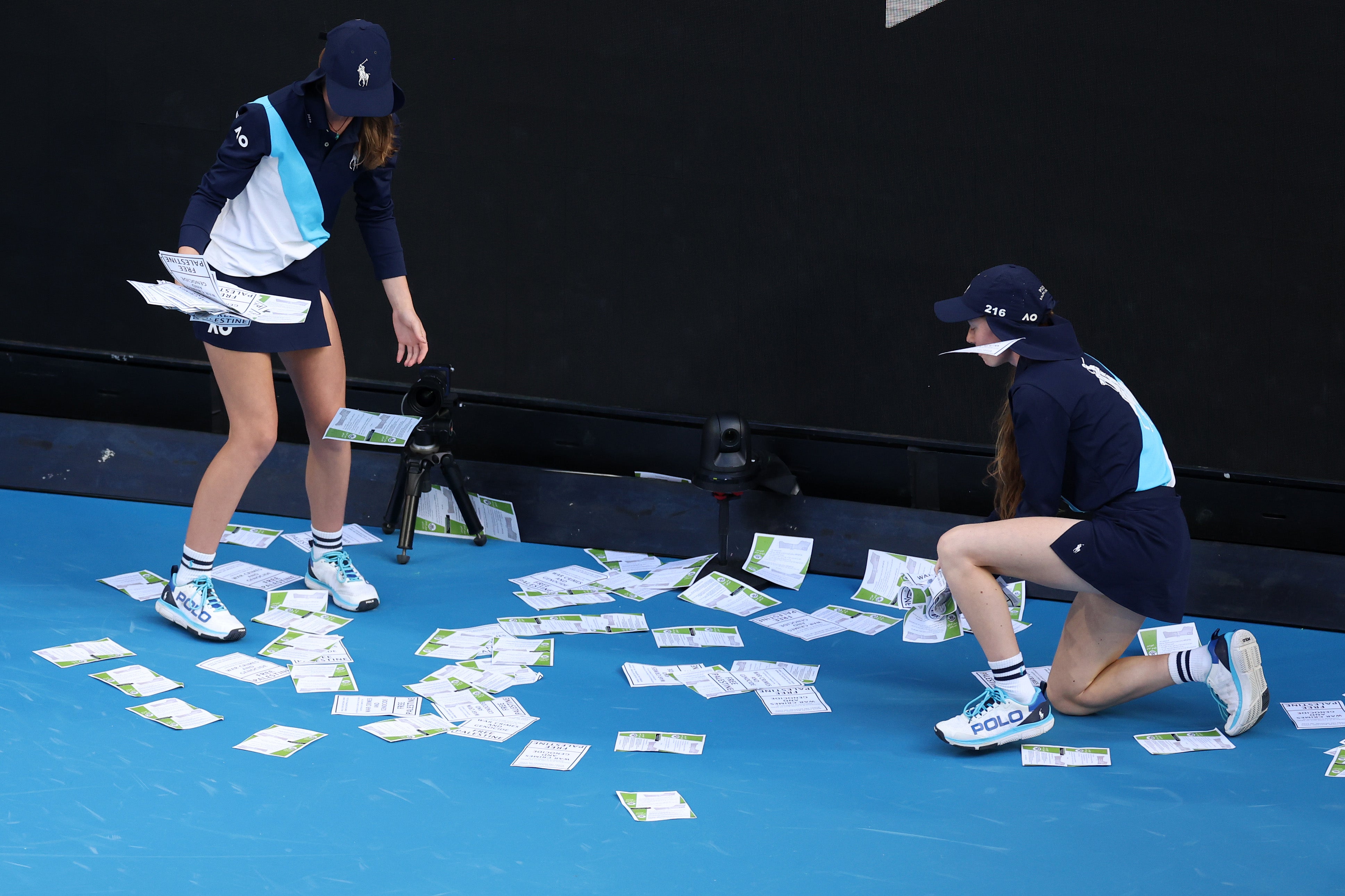 Some of the pieces of paper had to picked up off the court