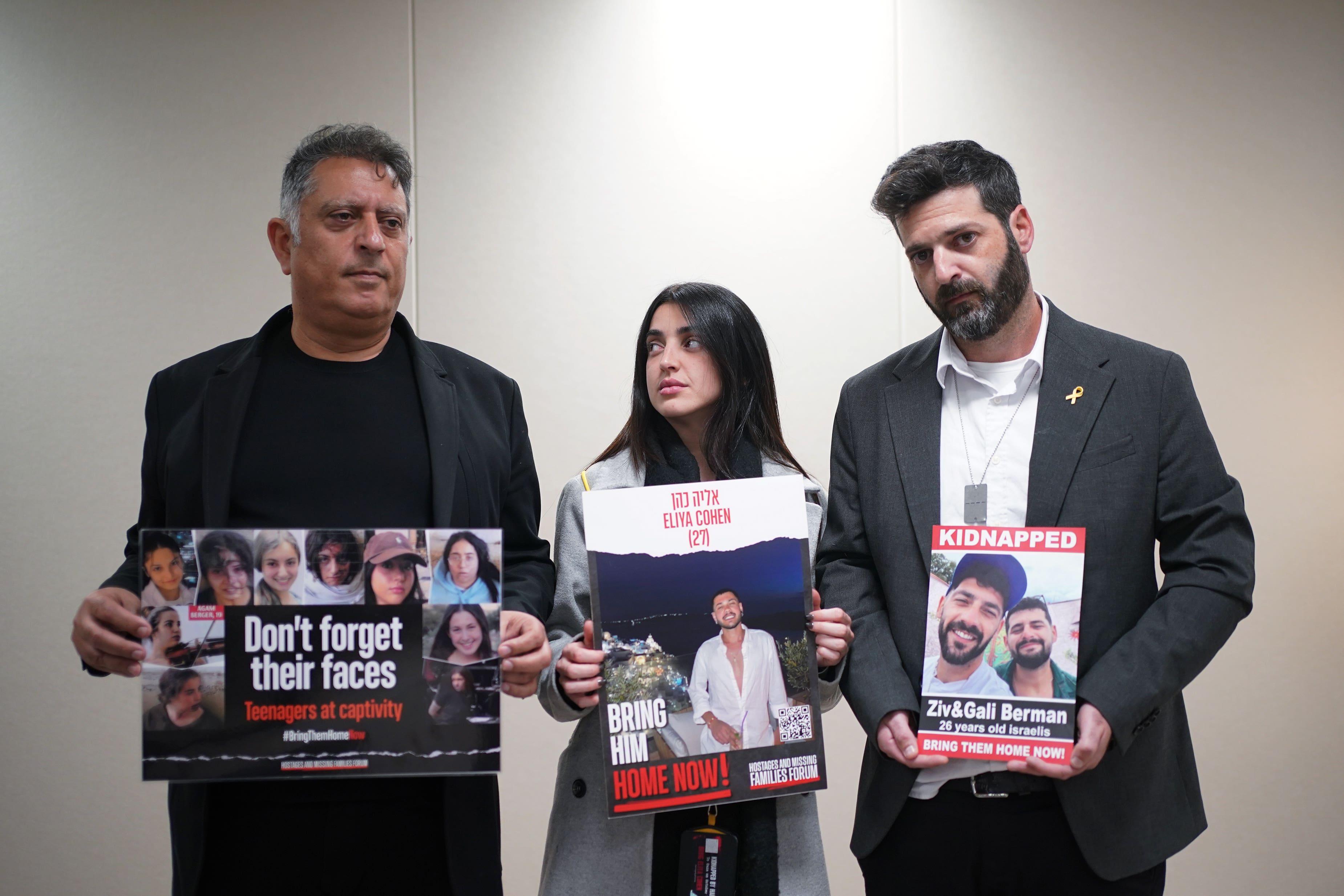 Family of people taken hostage by Hamas in Israel on October 7 (left to right) Eli Albag, the father of 18-year-old Liri Albag; Ziv Abud, the girlfriend of 26-year-old Eliya Cohen; and Liran Berman, the brother of twins Ziv and Gali Berman. Picture date: Monday January 22, 2024. (Yui Mok/PA)