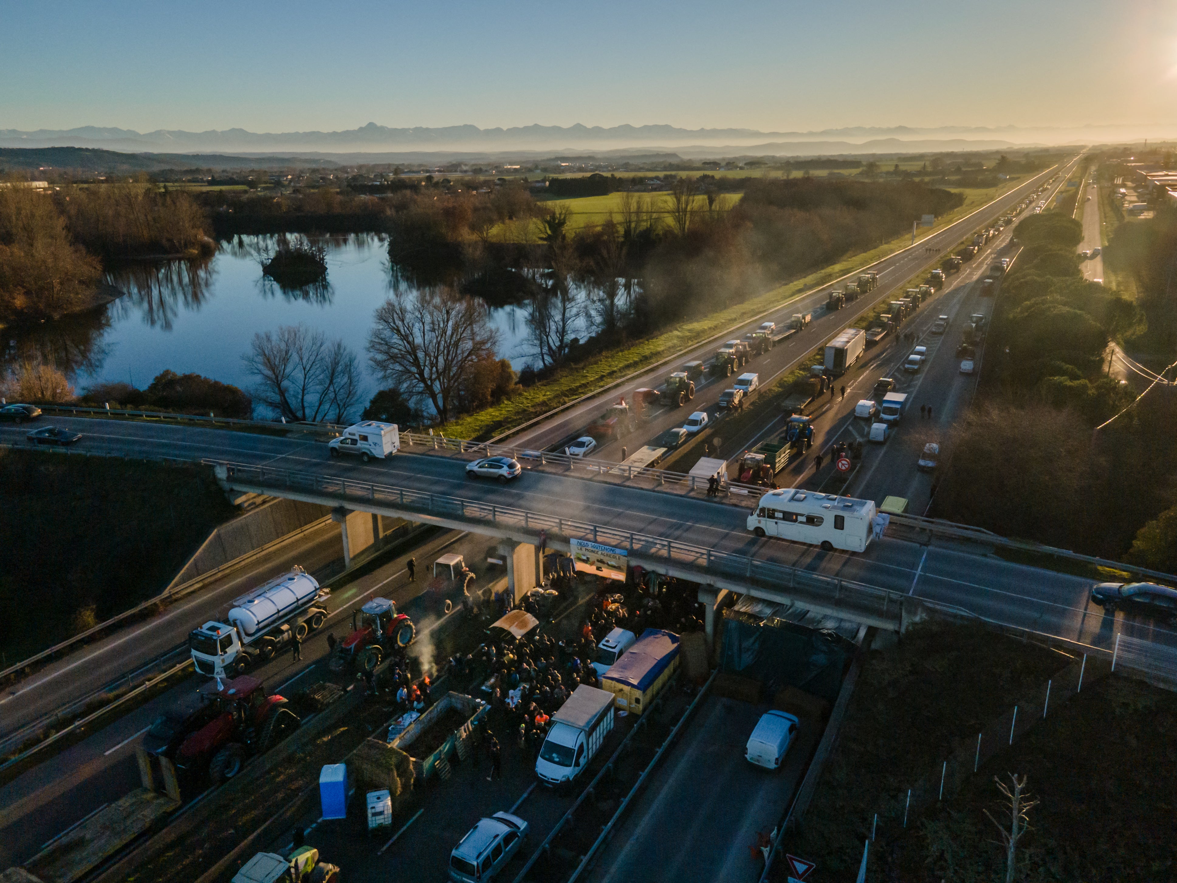 This aerial photograph shows farmers blocking the highway A64, to protest against taxation and declining income