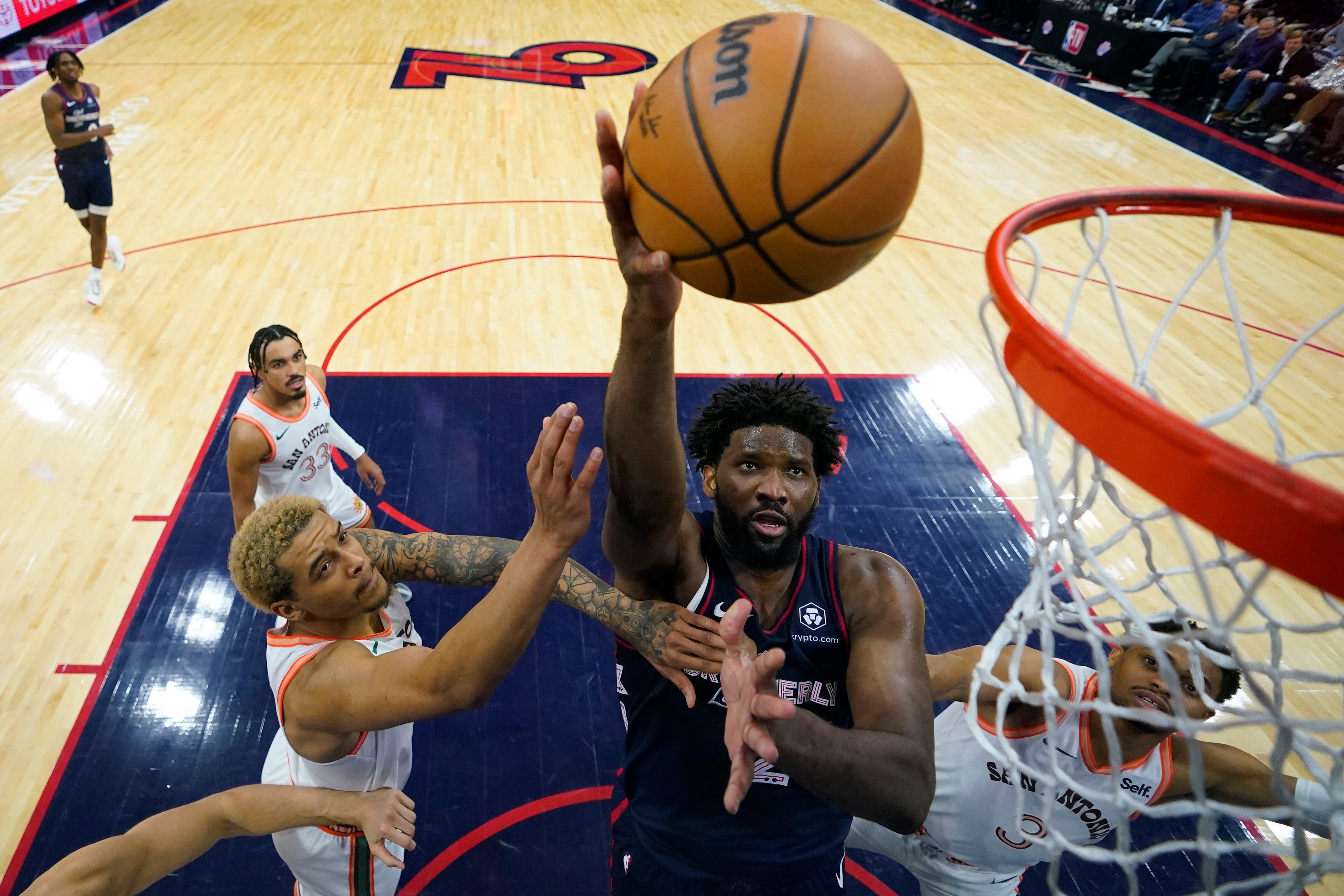 Joel Embiid (centre) scored a Philadelphia 76ers’ record 70 points against San Antonio Spurs (Matt Slocum/AP)