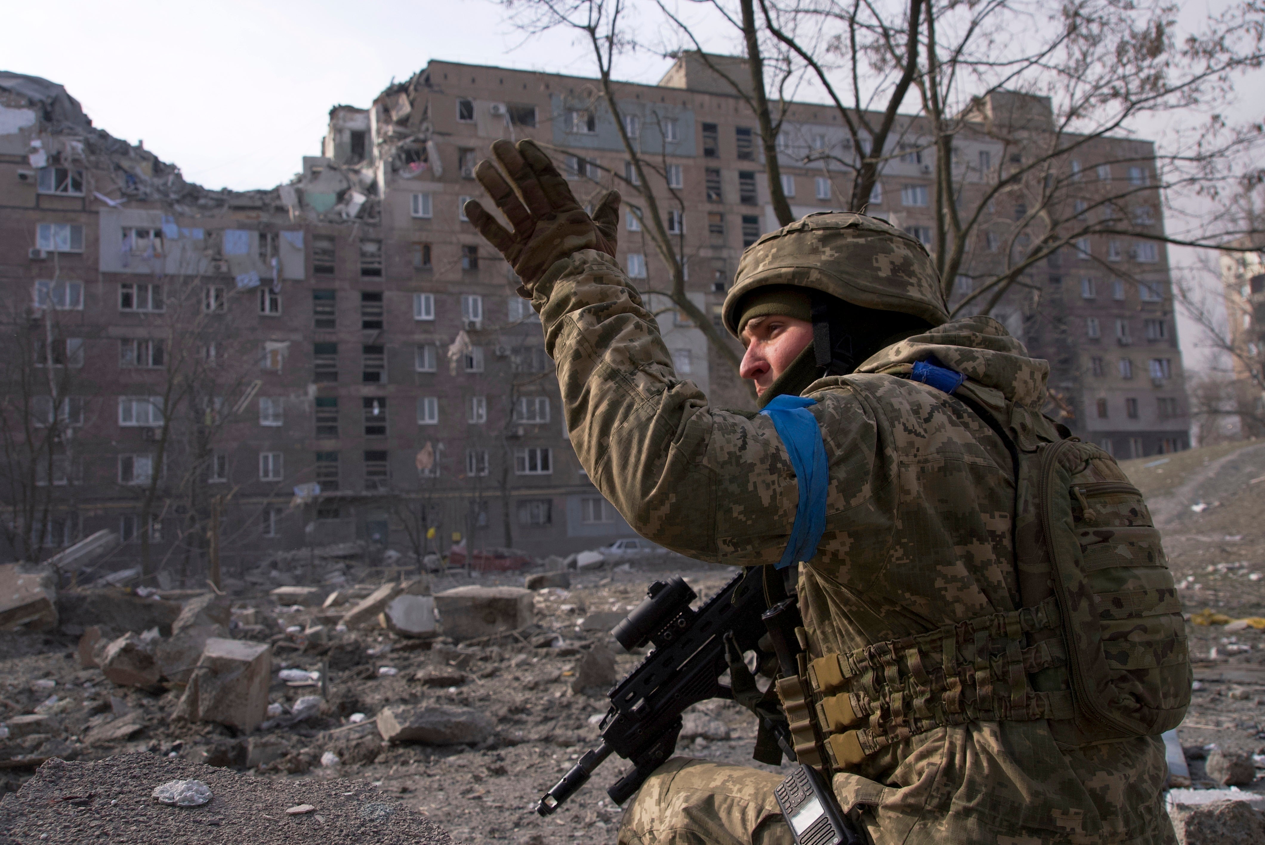 A Ukrainian serviceman guards his position in Mariupol earlier in the war