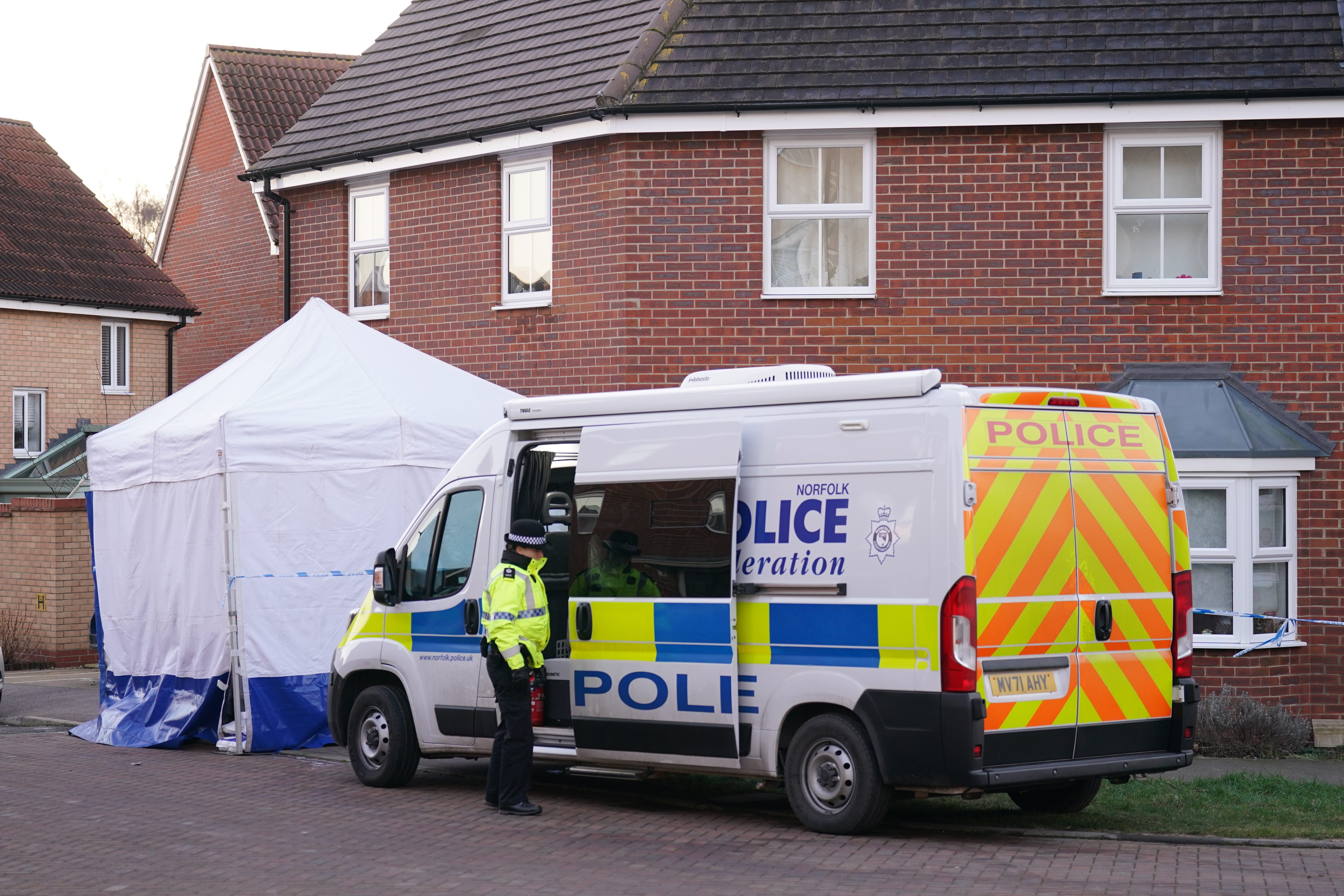 Police outside a house in Costessey near Norwich after four people were found dead inside the property (Joe Giddens/PA)