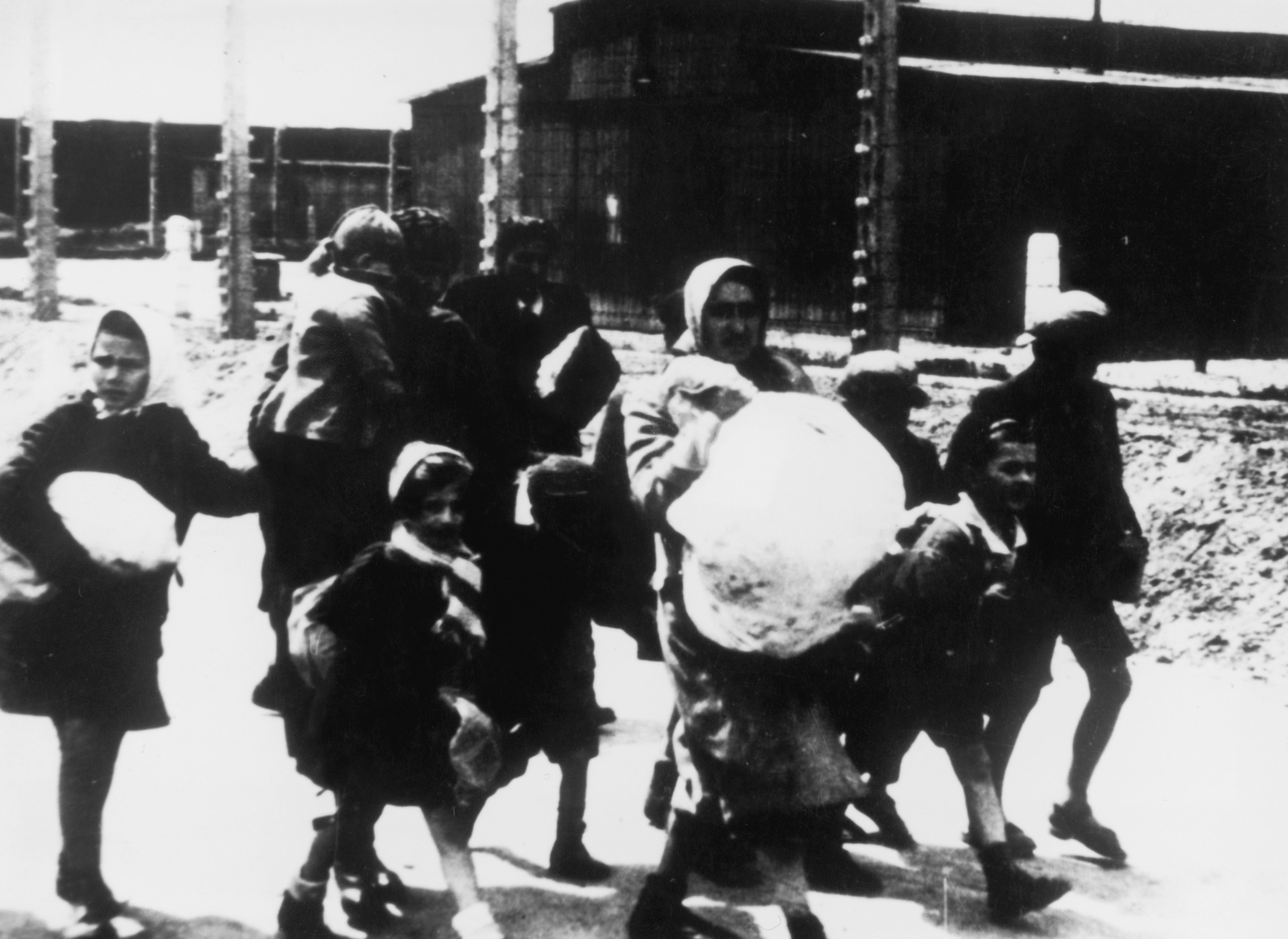 Women and children arriving at the Nazi concentration camp at Auschwitz, Poland, circa 1943