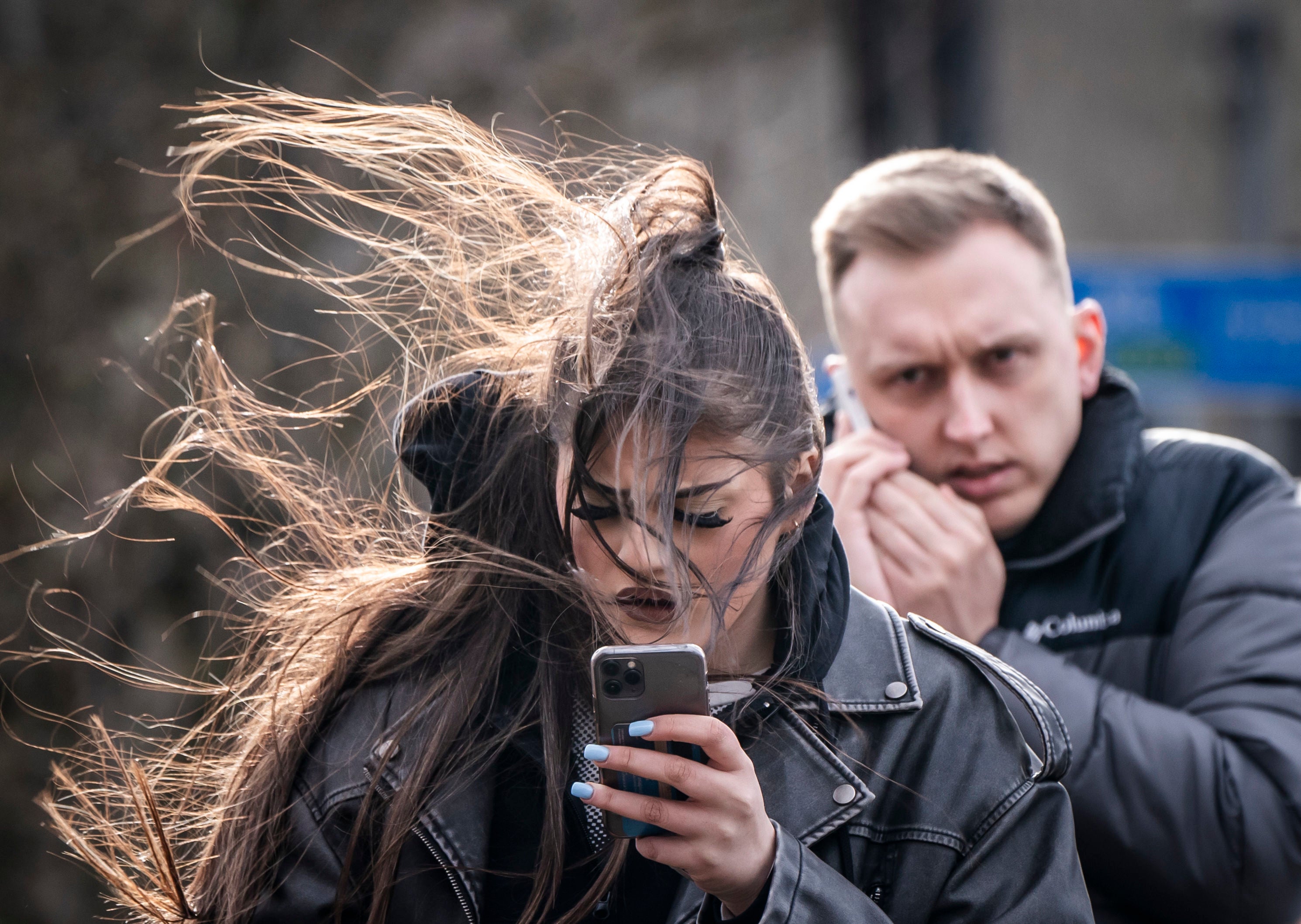 A woman in windy conditions in Leeds. Storm Jocelyn has brought fresh travel disruption to much of the UK