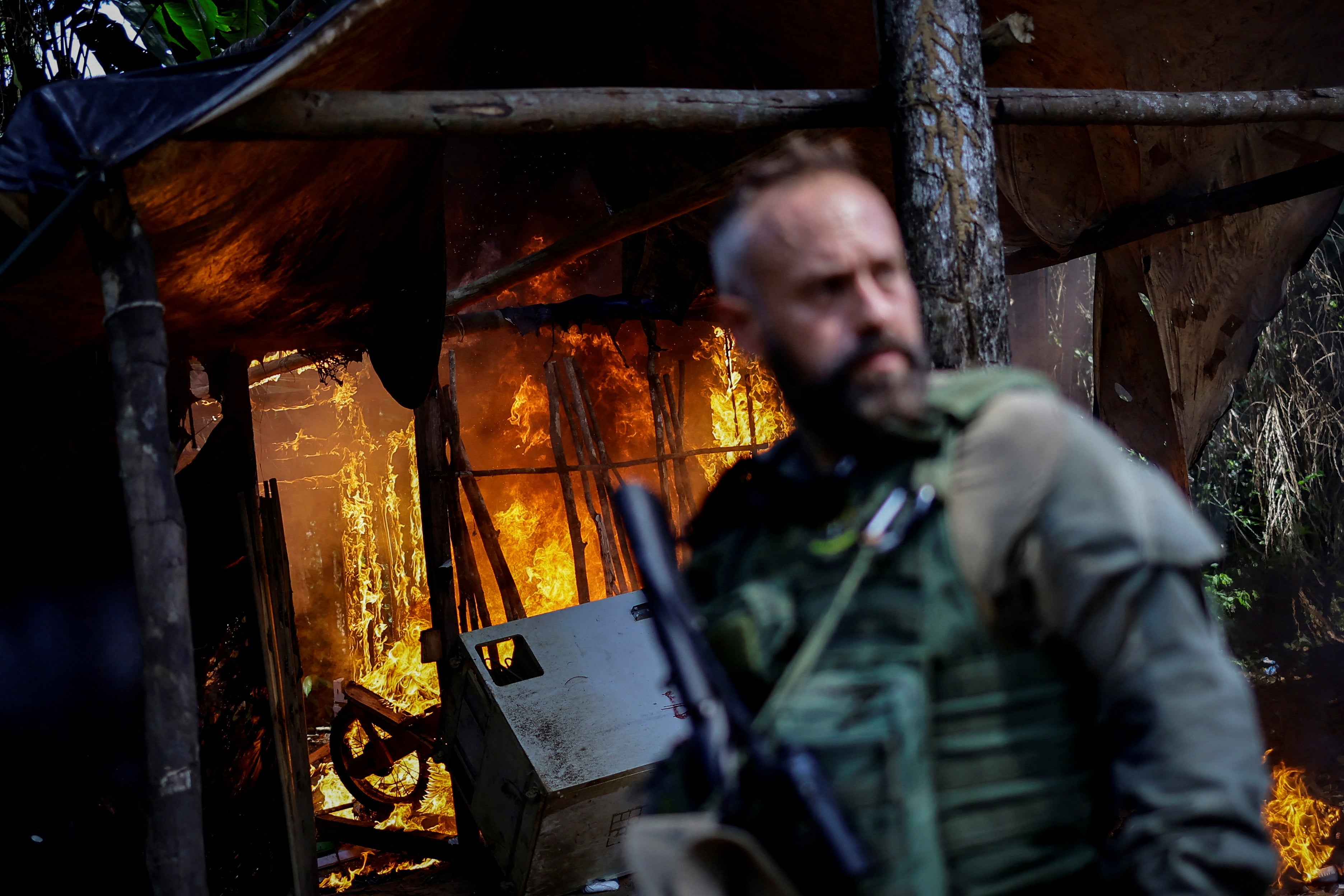 Hugo Loss, operations coordinator for Ibama, Brazil’s environment agency, destroys a miners’ camp