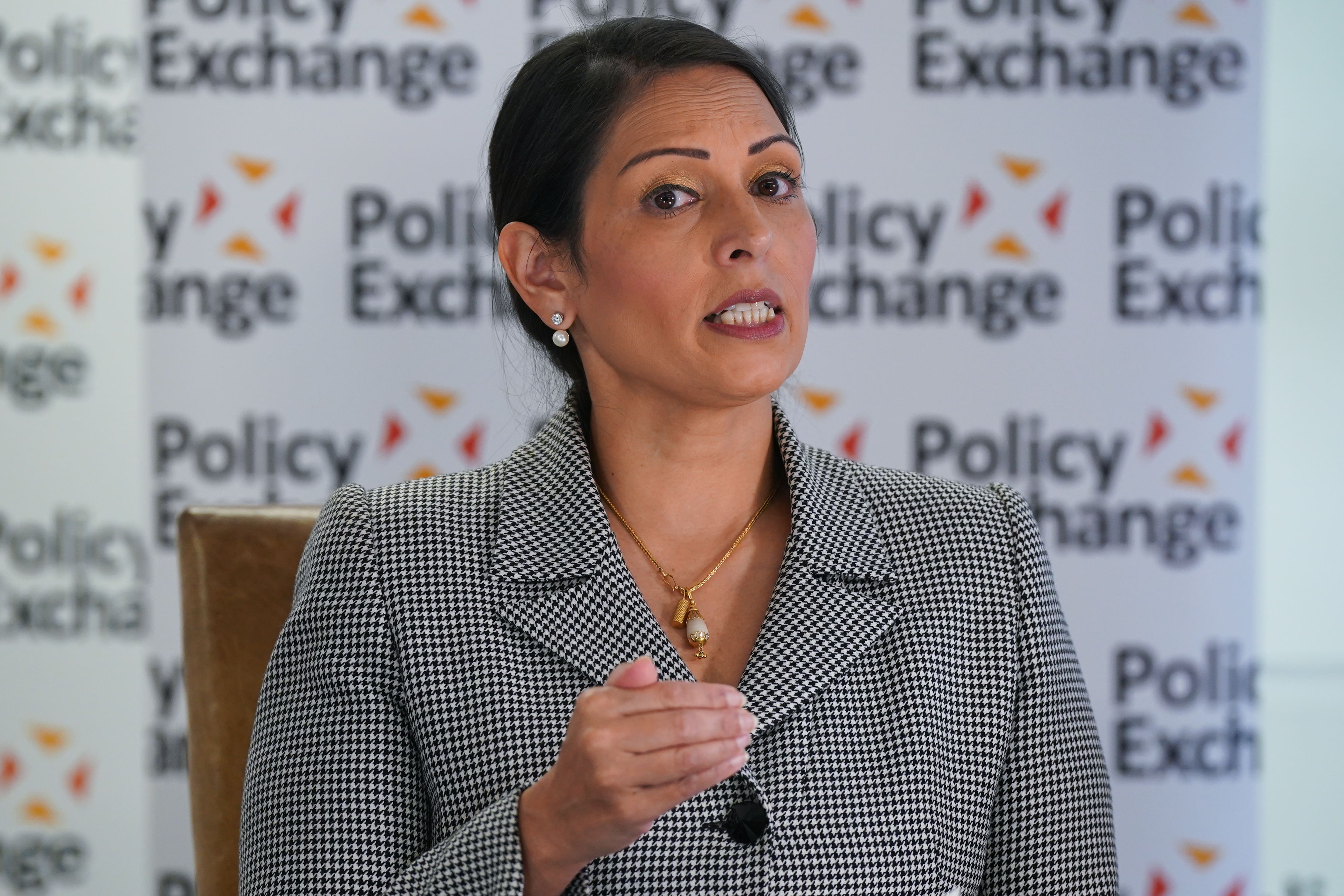 Dame Priti Patel has been heckled by climate activists (Lucy North/PA)