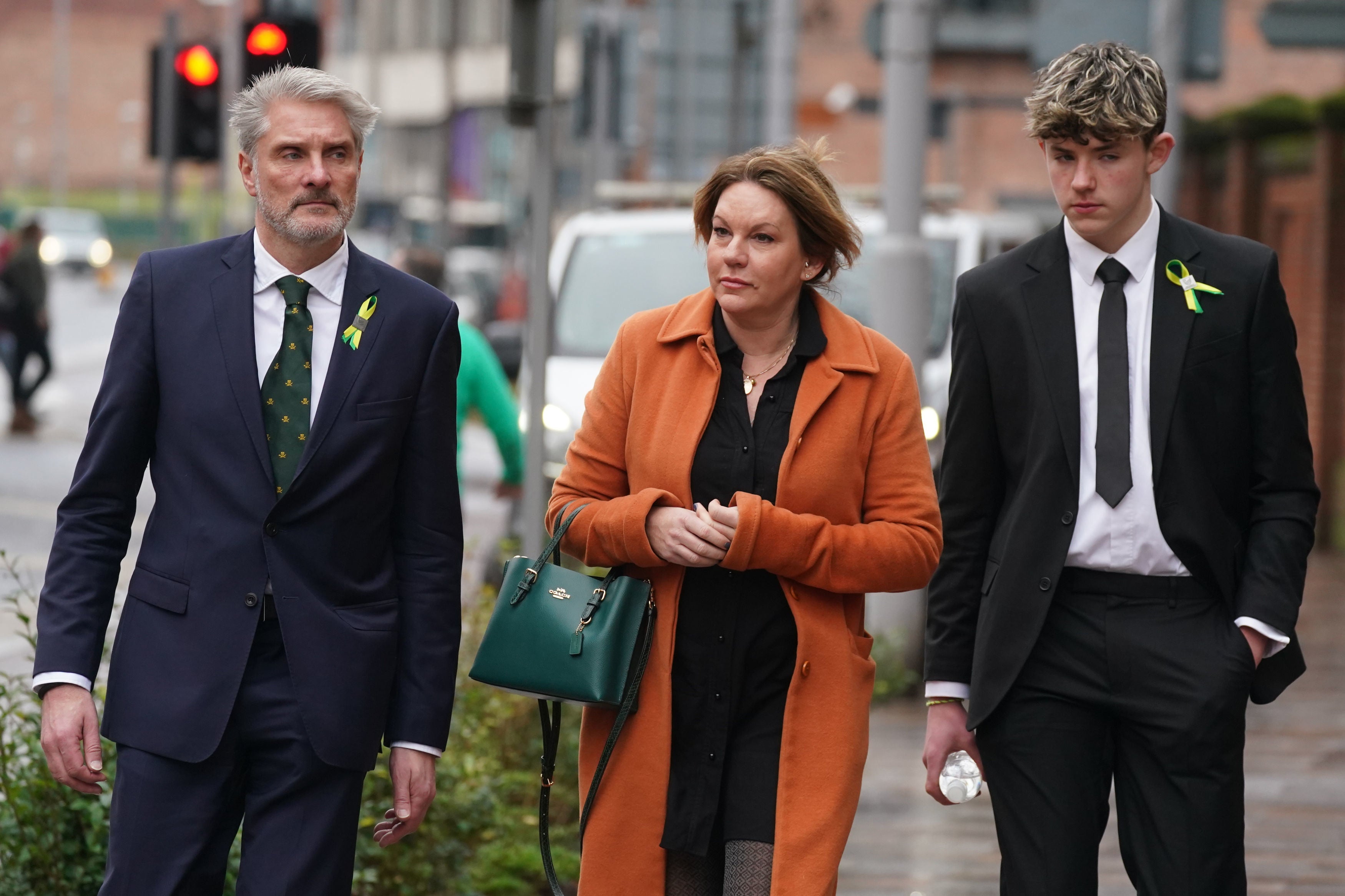 Barnaby Webber's family (left to right) father David Webber, mother Emma Webber and brother Charlie Webber, previously arriving at Nottingham Crown Court