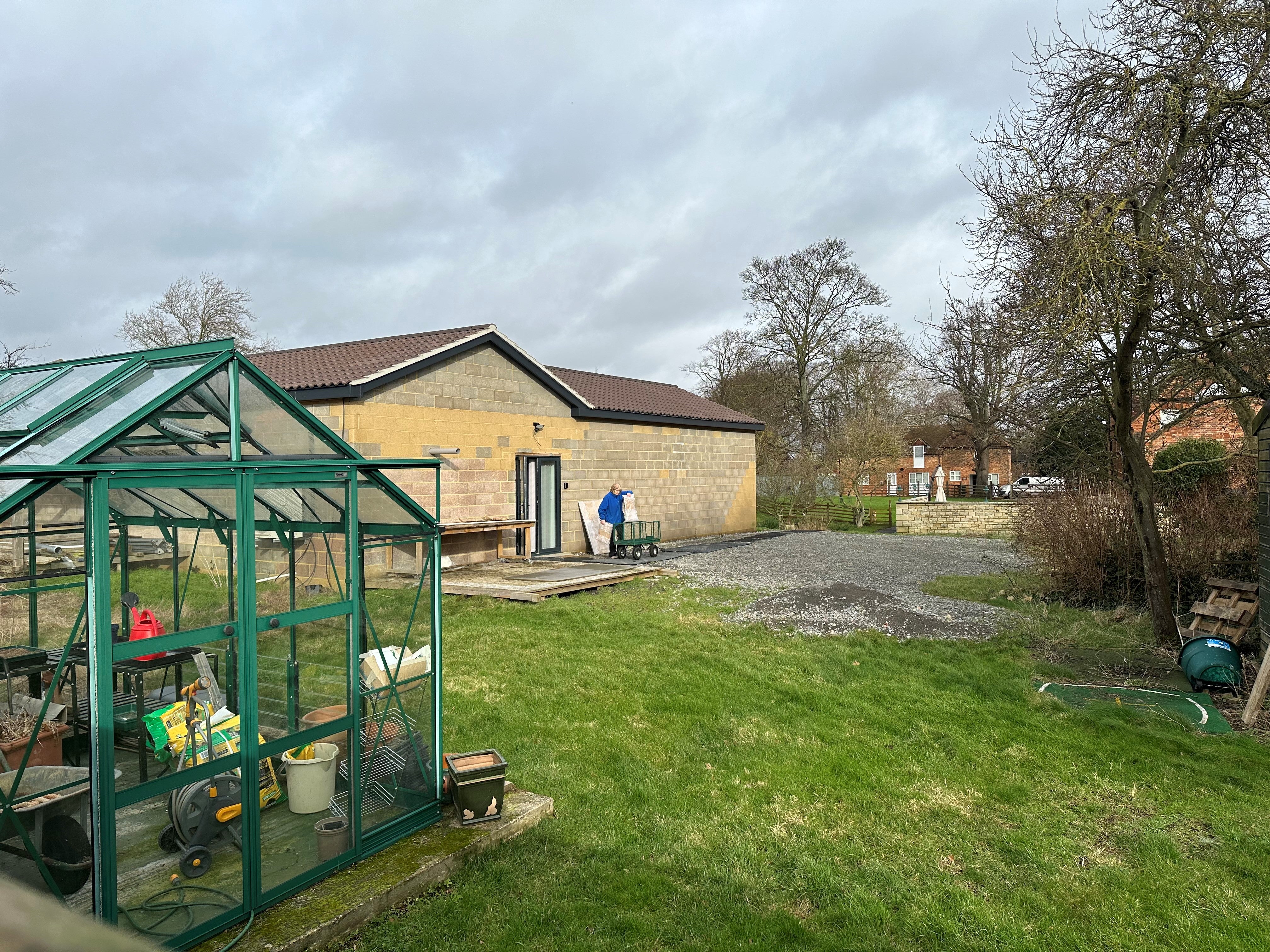 Items are removed from the concrete building which neighbours liken to a prison block