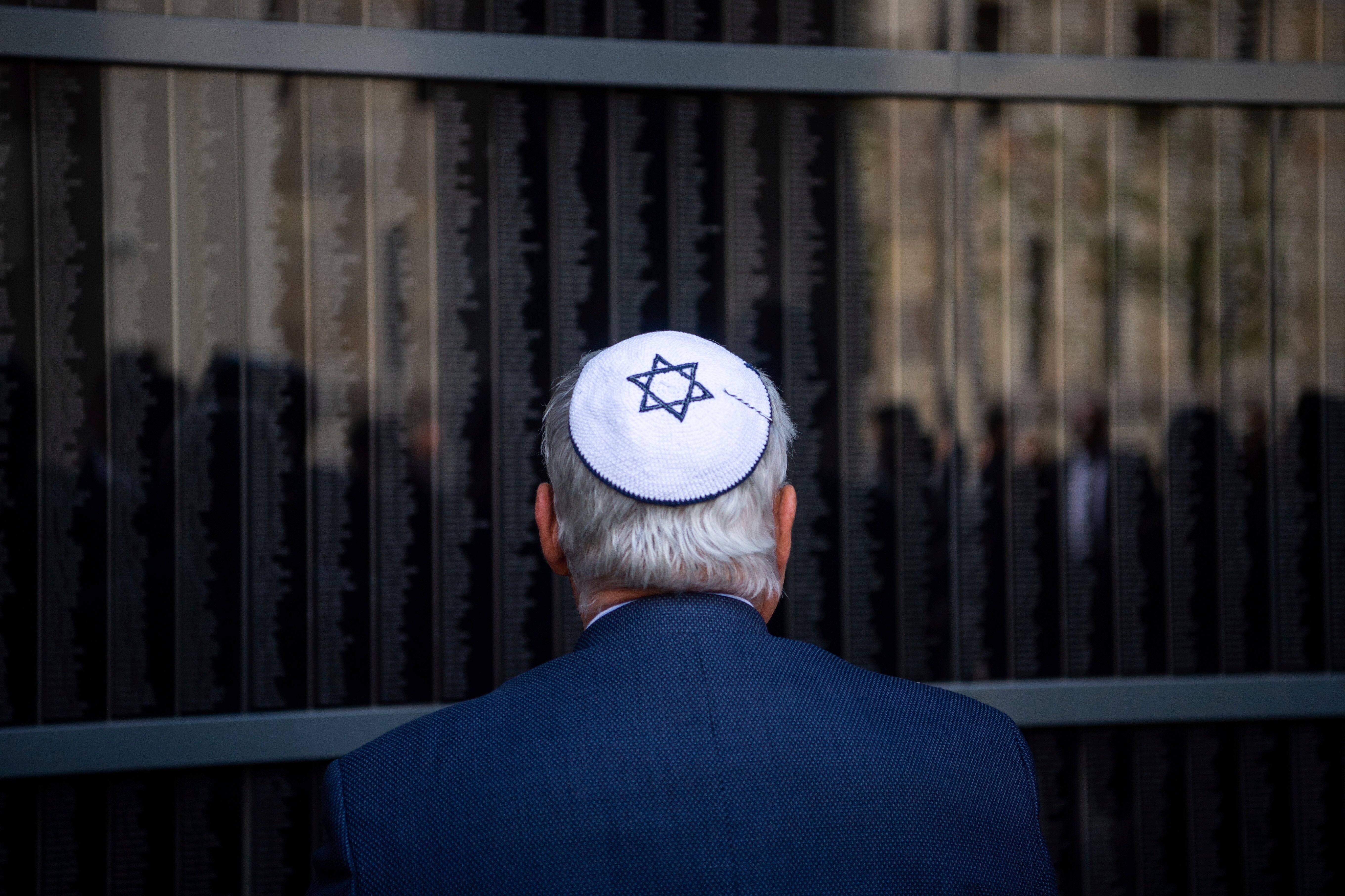 A man stands in front of Budapest’s Memorial Wall of Victims on International Holocaust Memorial Day