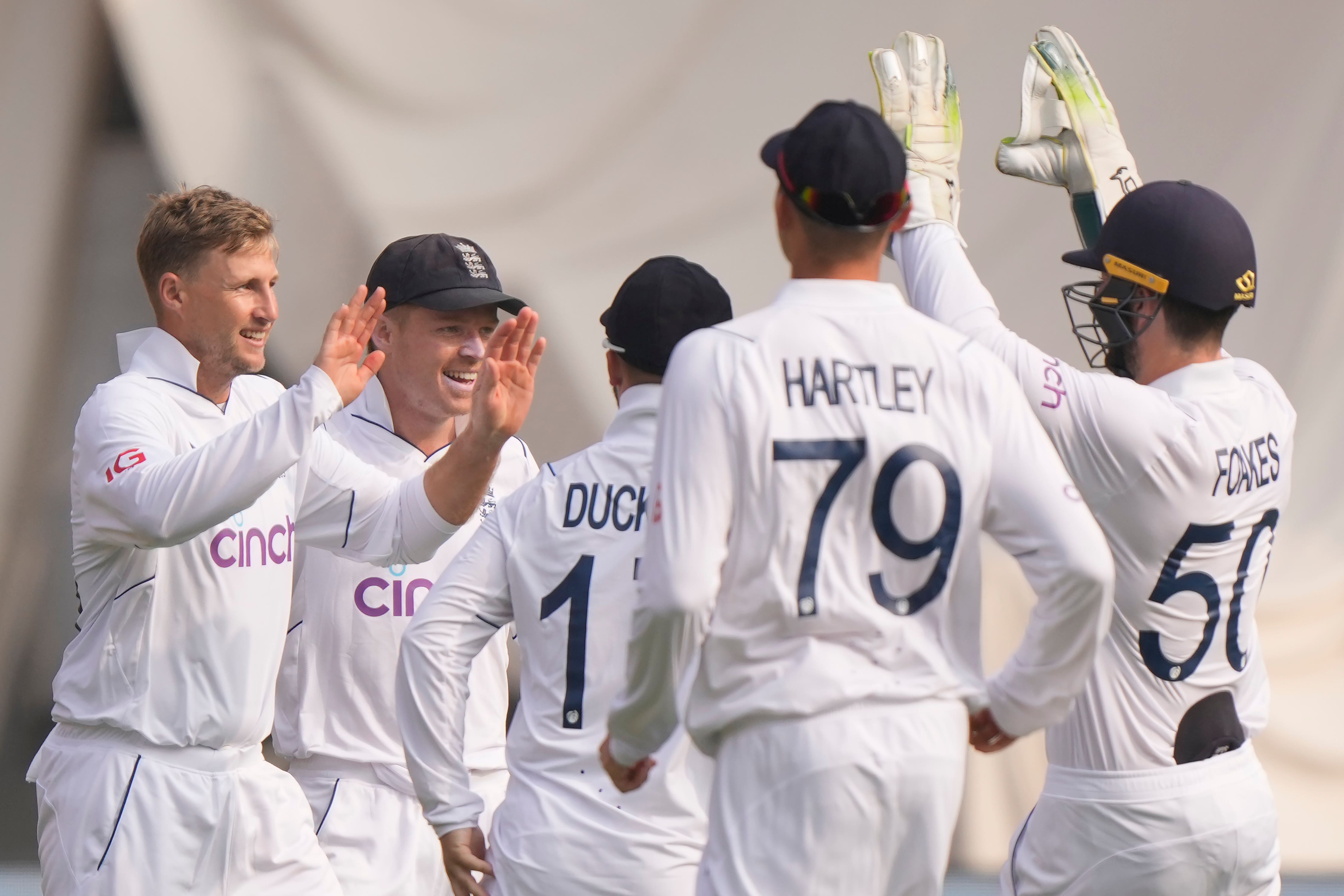 Joe Root (left) celebrates an early breakthrough (Mahesh Kumar/AP)