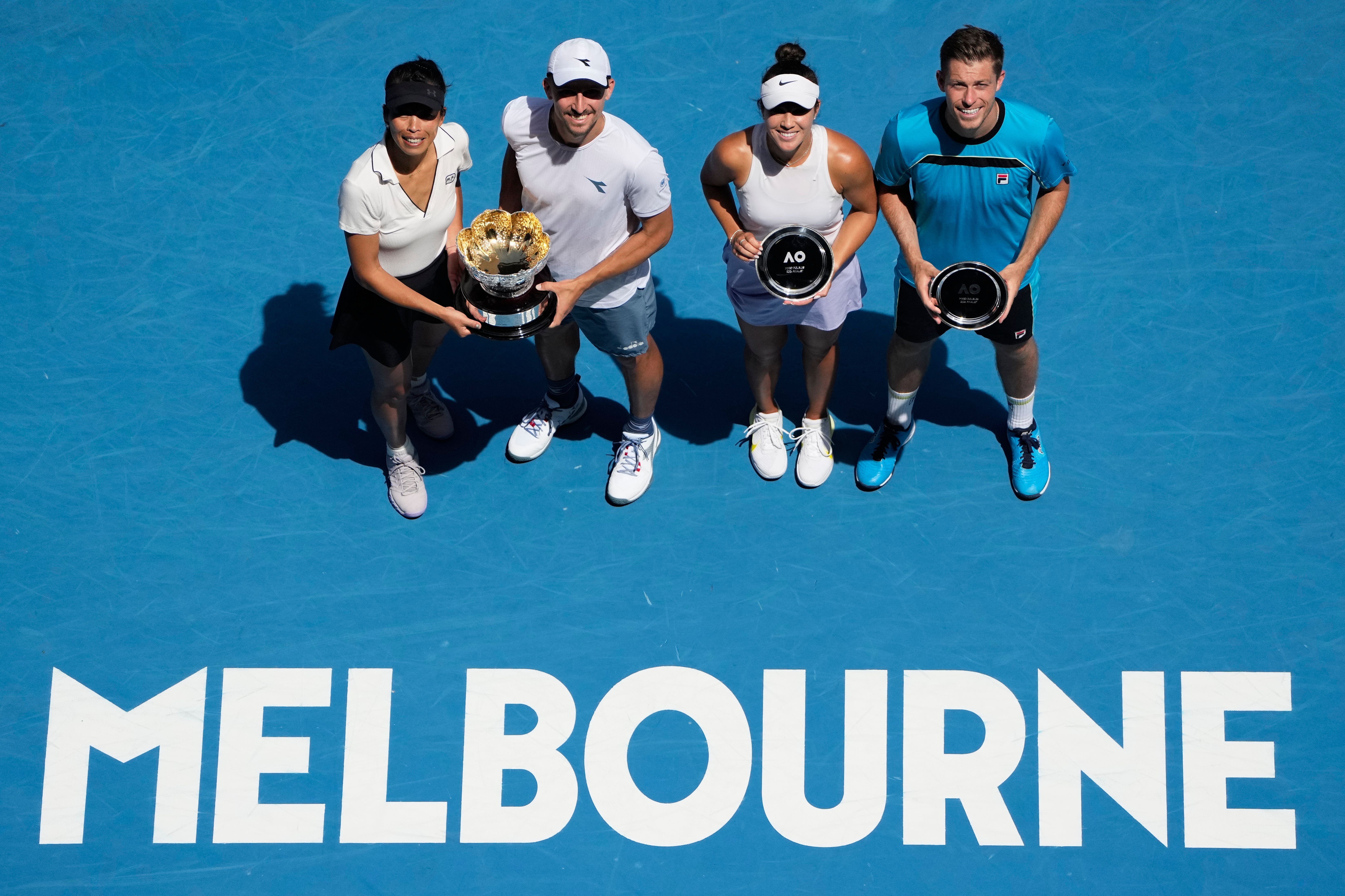 Neal Skupski, right, and Desirae Krawczyk, second right, were beaten in the mixed doubles final (Louise Delmotte/AP)