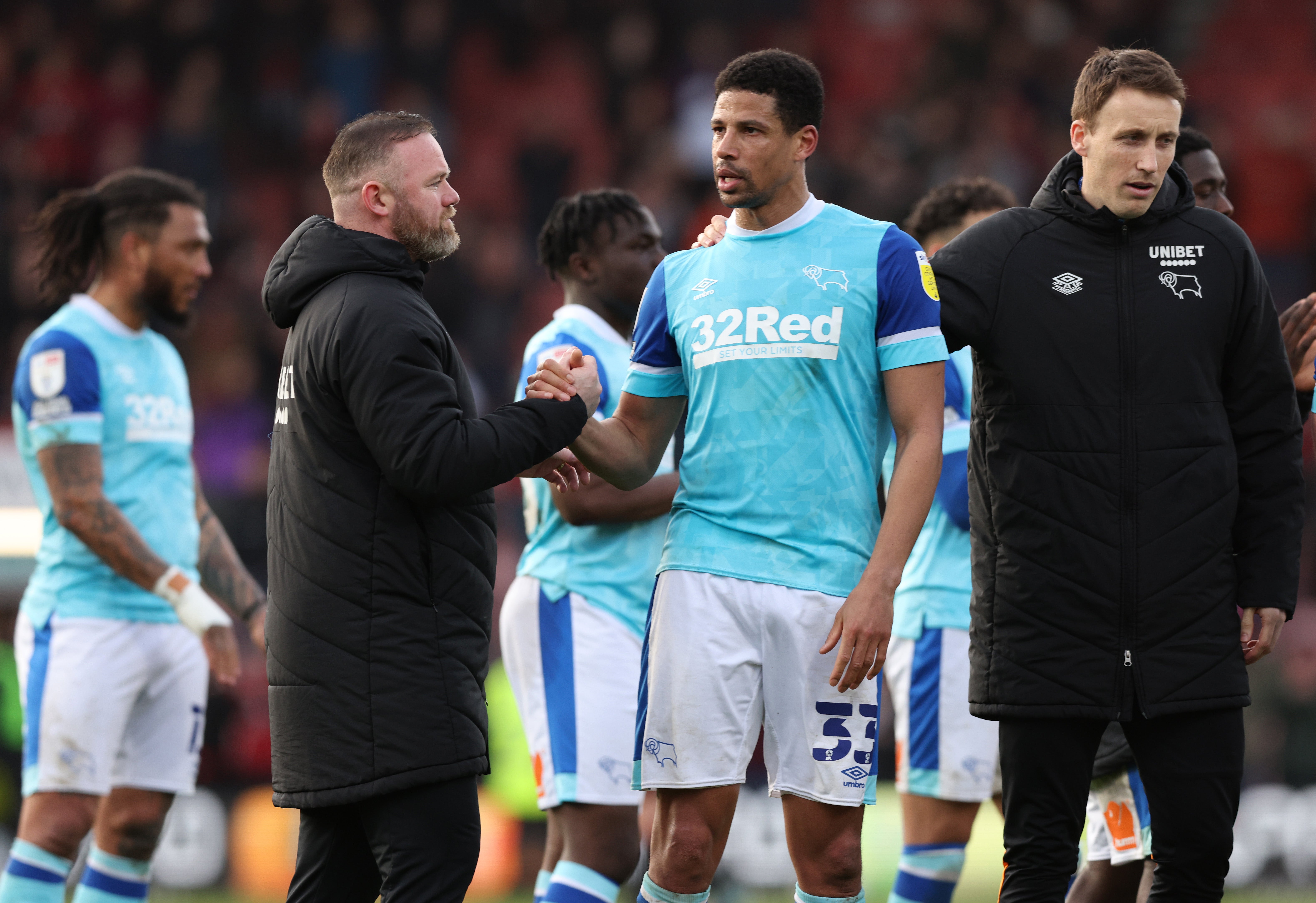 Wayne Rooney embraces Curtis Davies during their time together at Derby County