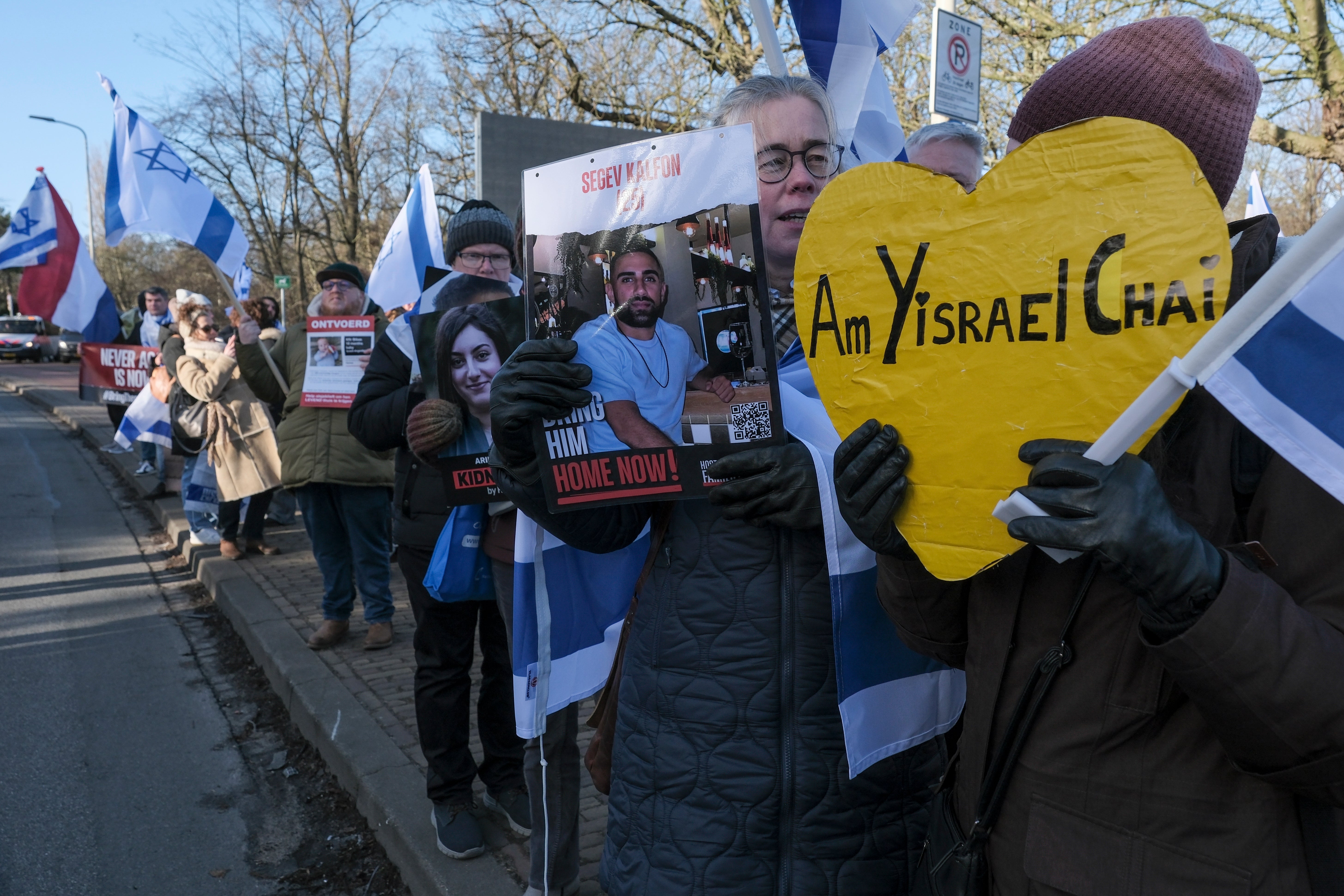 Pro-Israel activists gather near the International Court of Justice, or World Court, in The Hague, Netherlands, on Friday