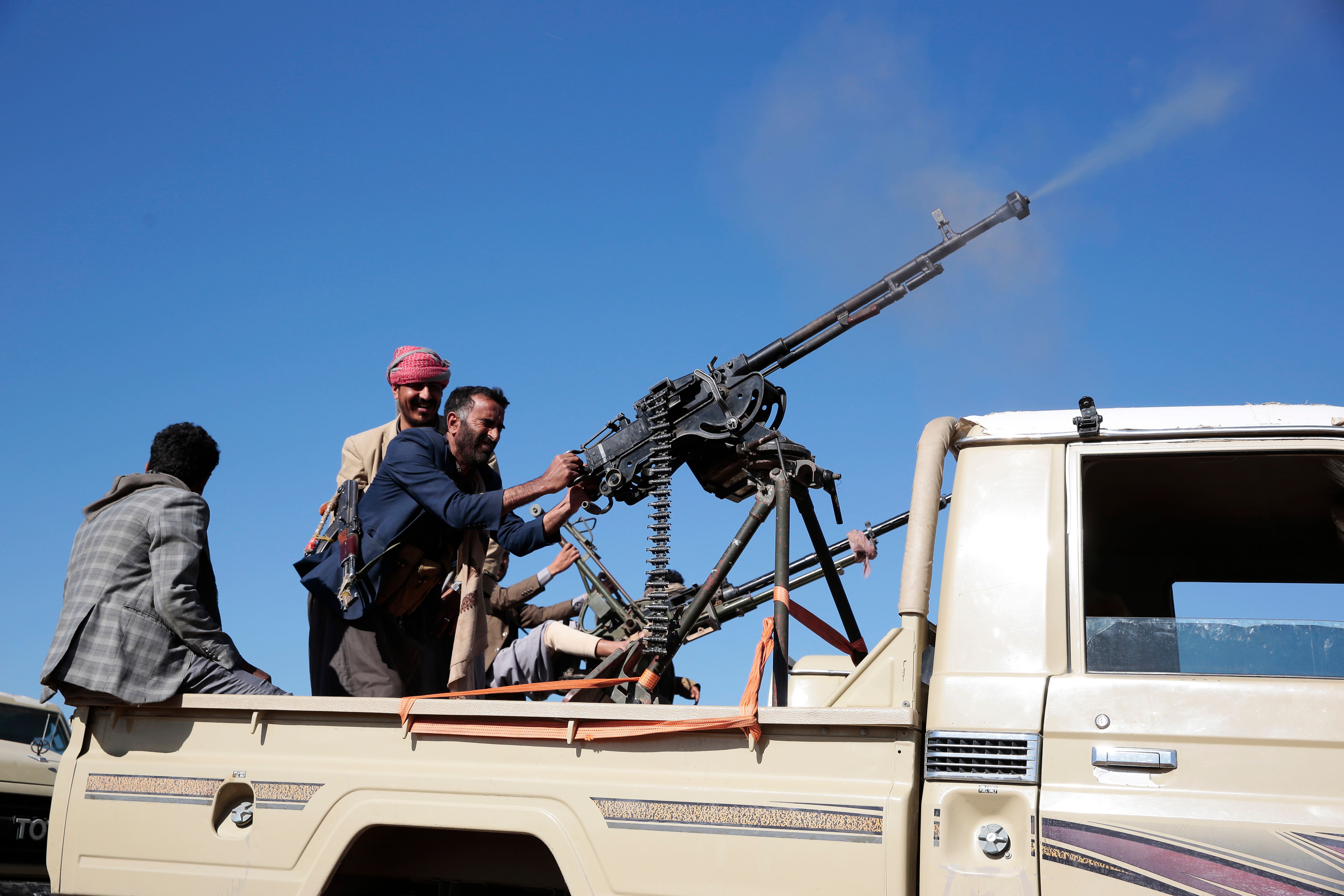 Houthi fighters during a rally against the US government designating Houthis as a terror group and against the US-UK air strikes (AP/Osamah Abdulrahman )