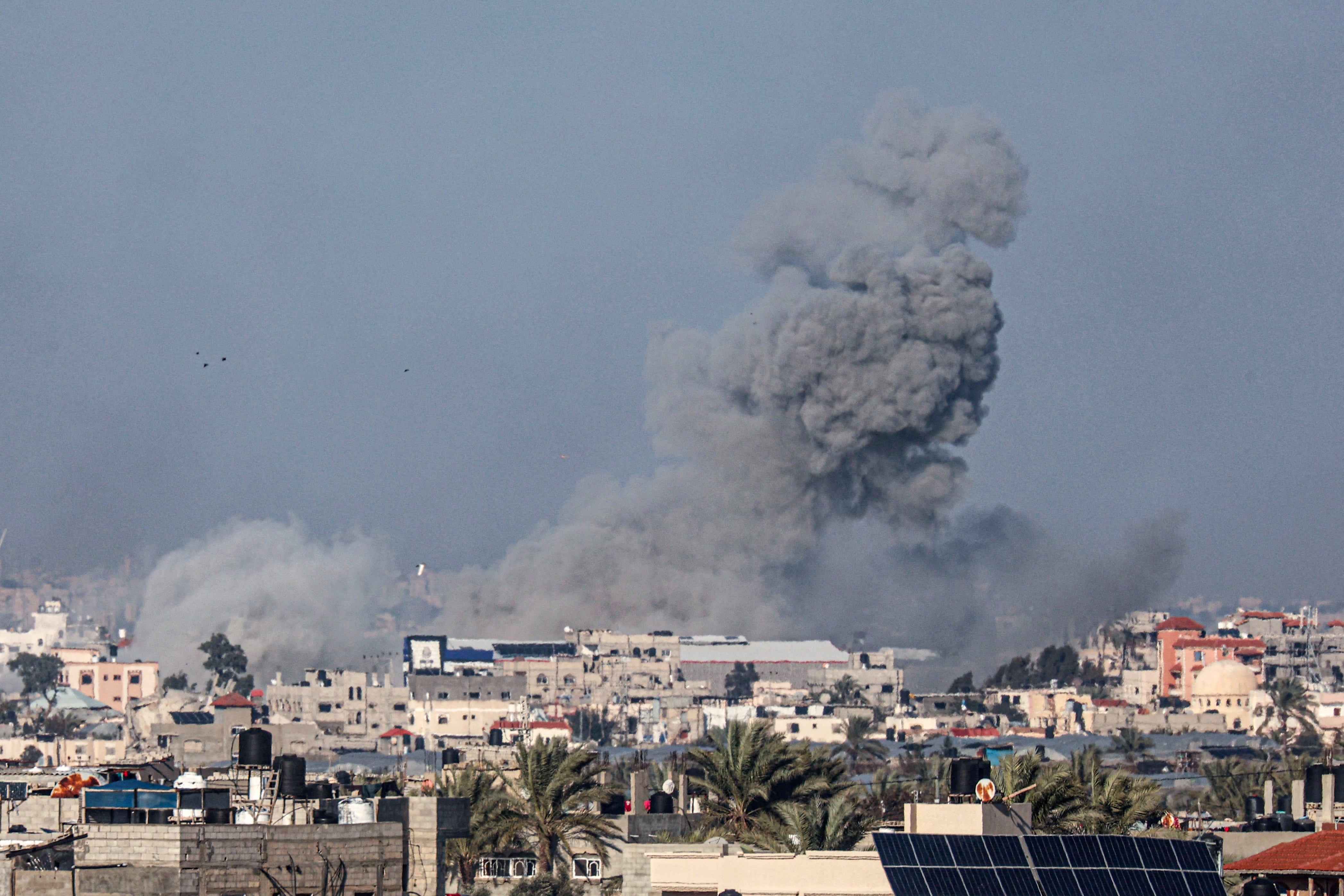 Smoke billows after an Israeli strike in Rafah in southern Gaza on 26 January.