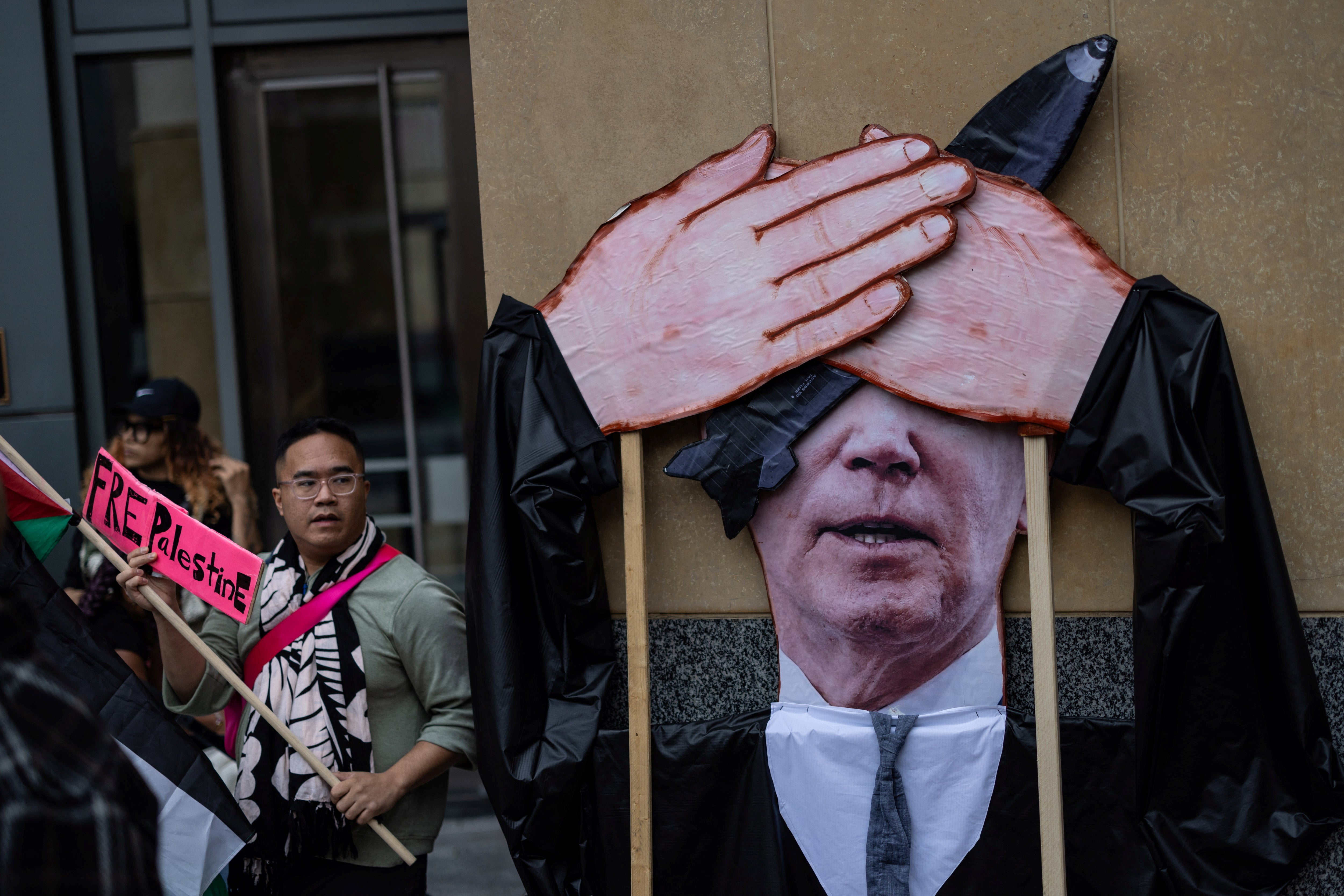 Protesters demonstrate outside a federal courthouse in Oakland, California, where a group of Palestinian plaintiffs and aid groups are asking a judge to block the Biden administration’s support for Israel’s campaign in Gaza.