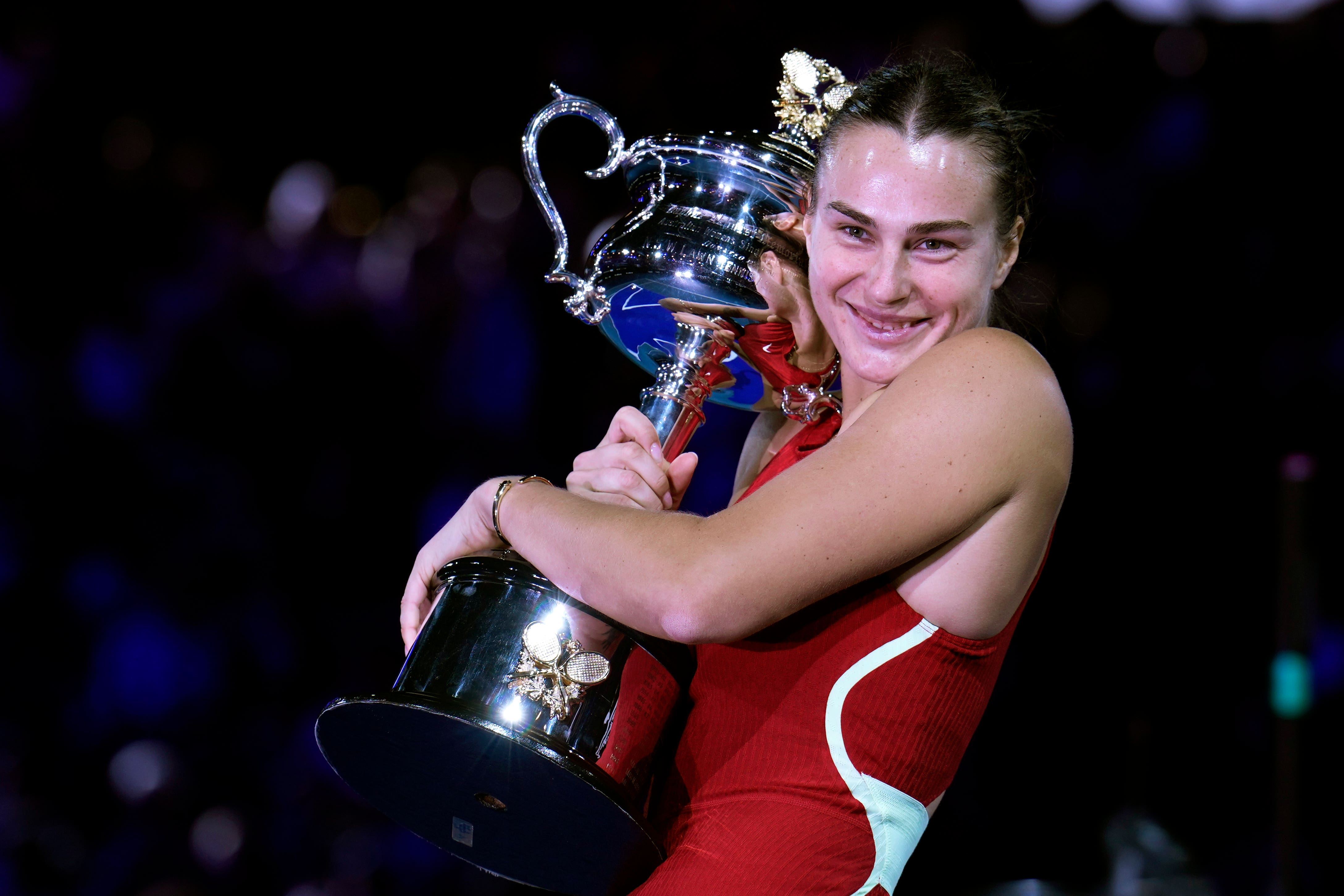 Aryna Sabalenka holds the Daphne Akhurst Memorial Cup (Andy Wong/AP)