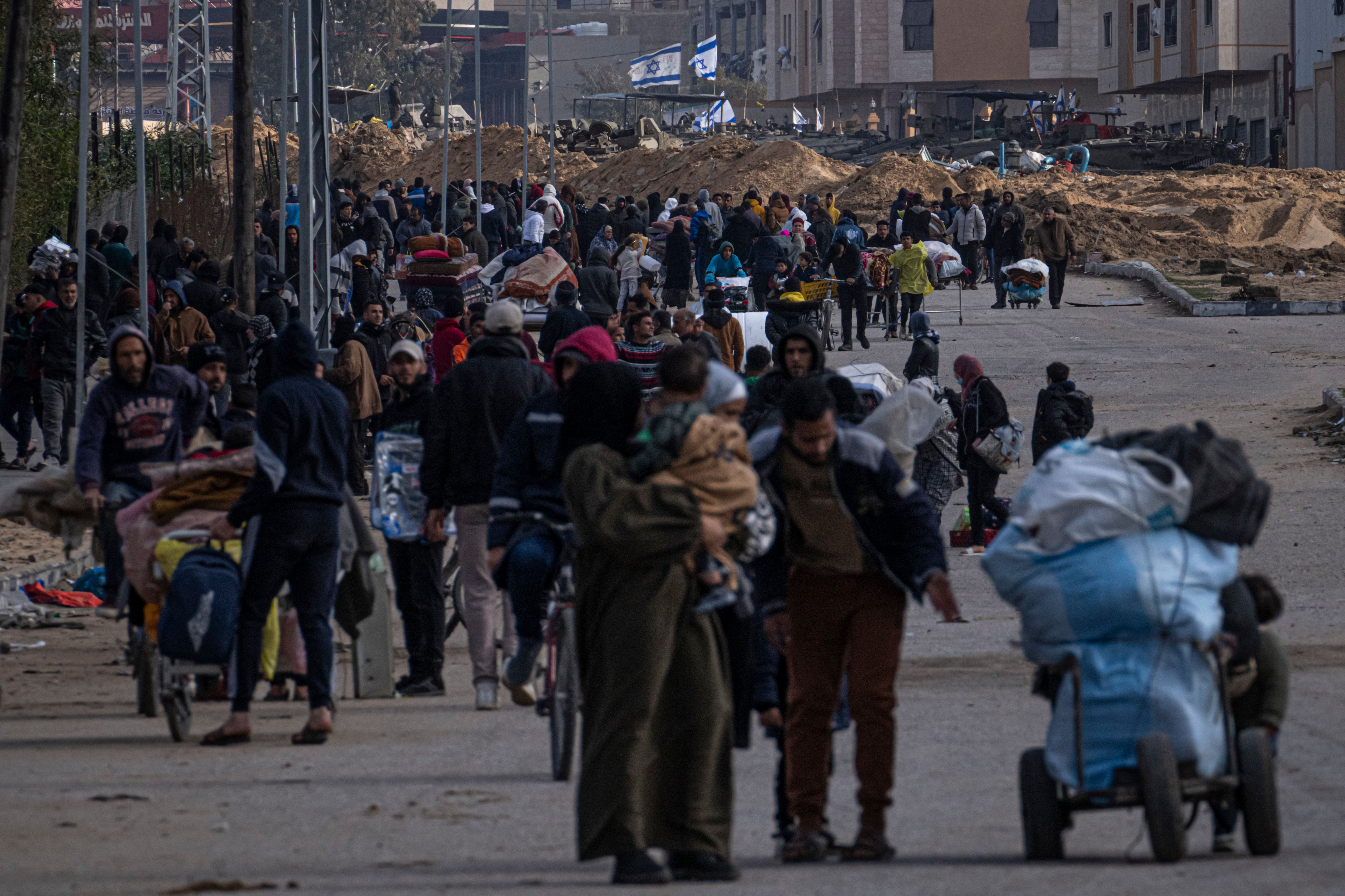 Palestinians flee the Israeli ground offensive in Kahn Younis in the Gaza Strip (Fatima Shbair/AP/PA)