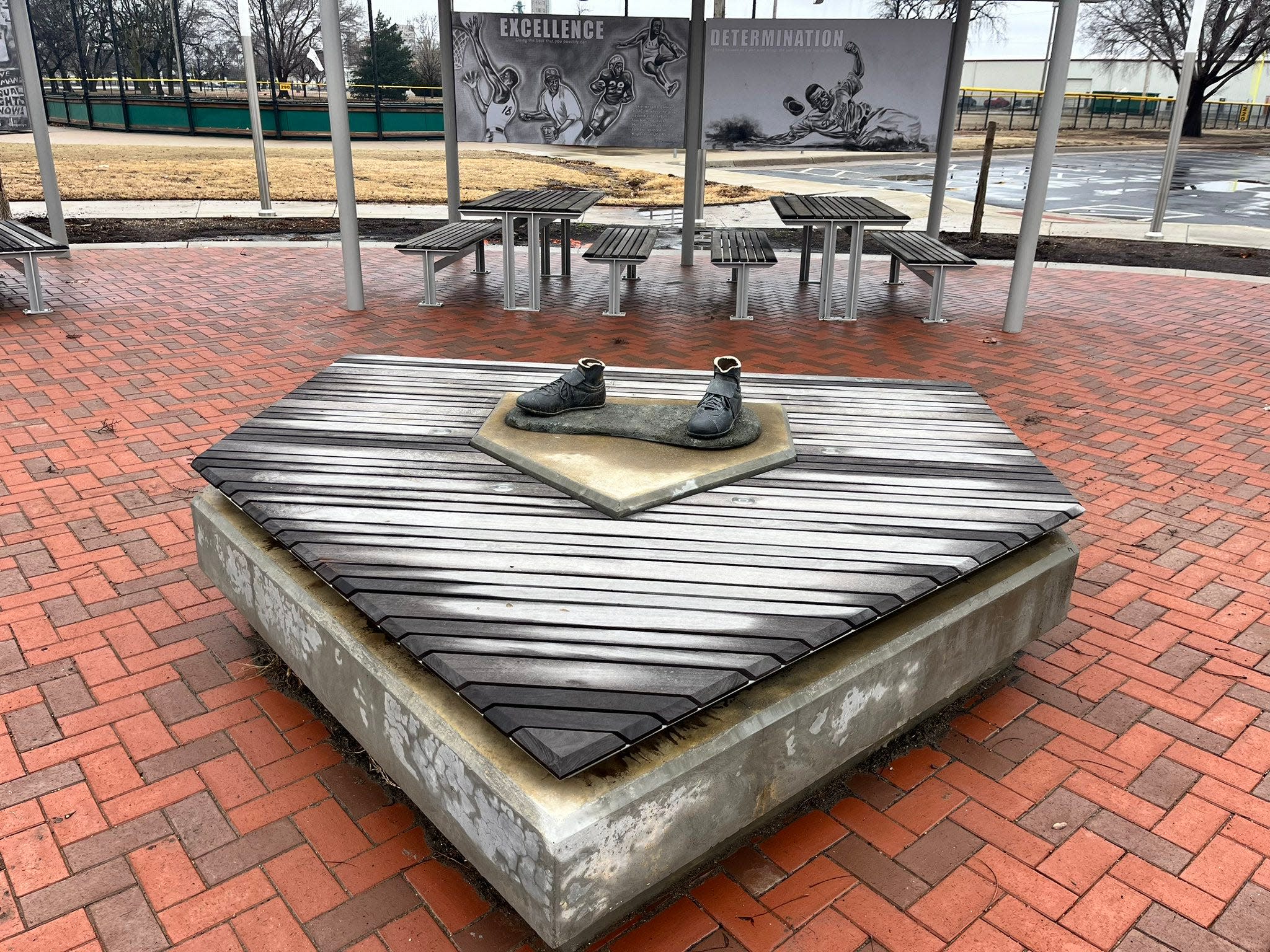 Only the shoes remain after thieves cut down and stole a Jackie Robinson statue in Wichita, Kansas