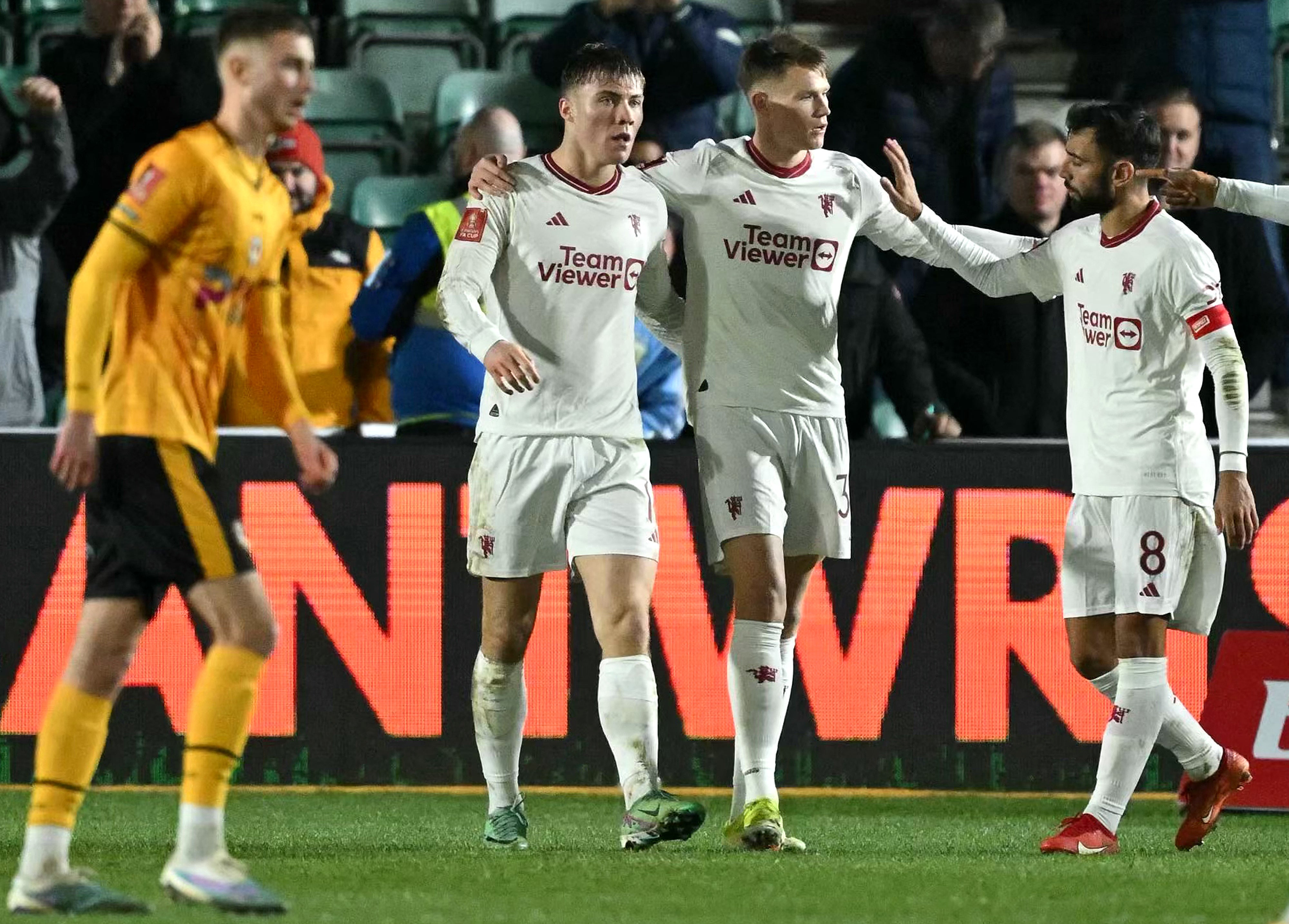 Manchester United celebrate scoring their fourth goal against Newport County