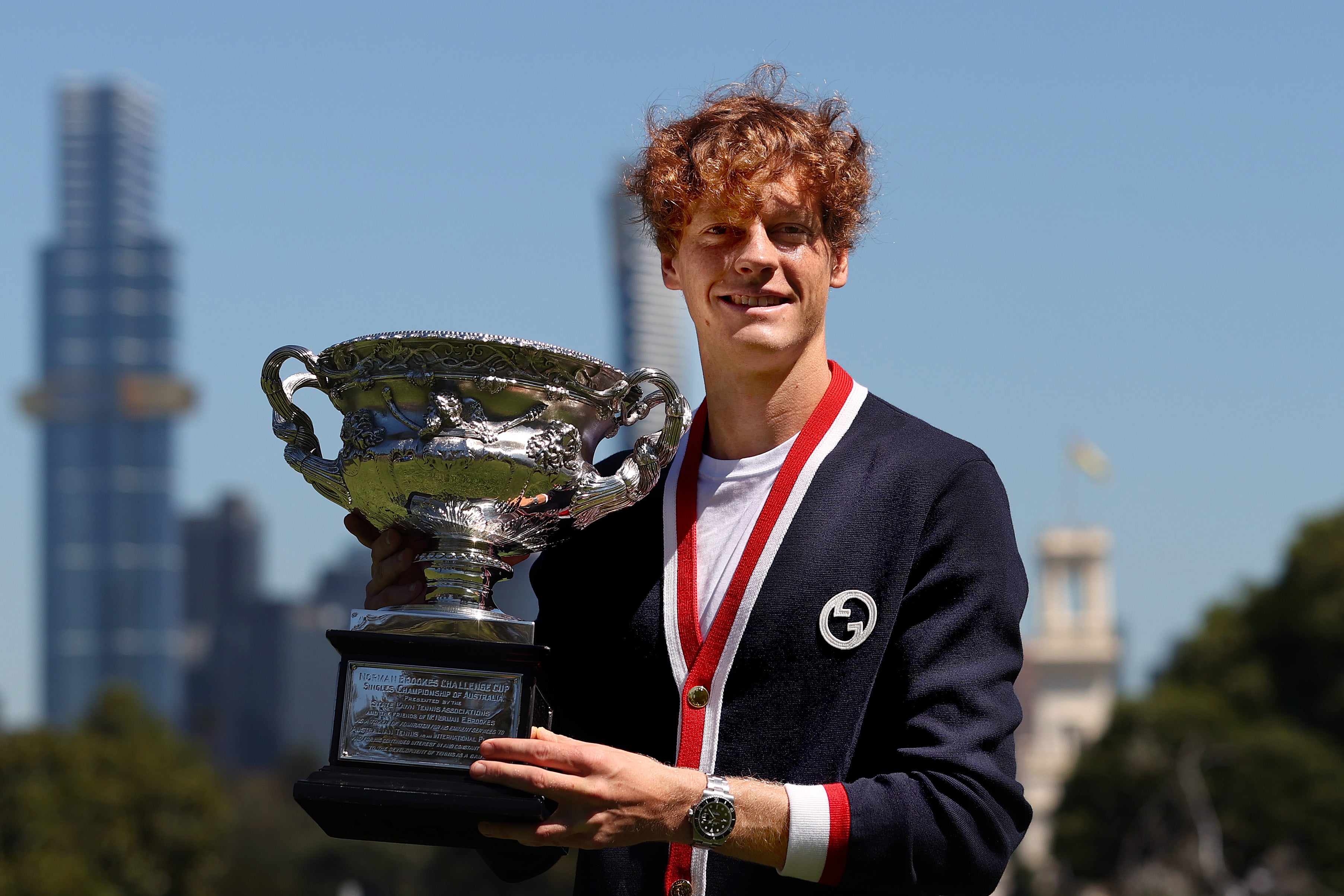 Jannik Sinner poses with the Norman Brookes Challenge Cup after winning the Australian Open Final