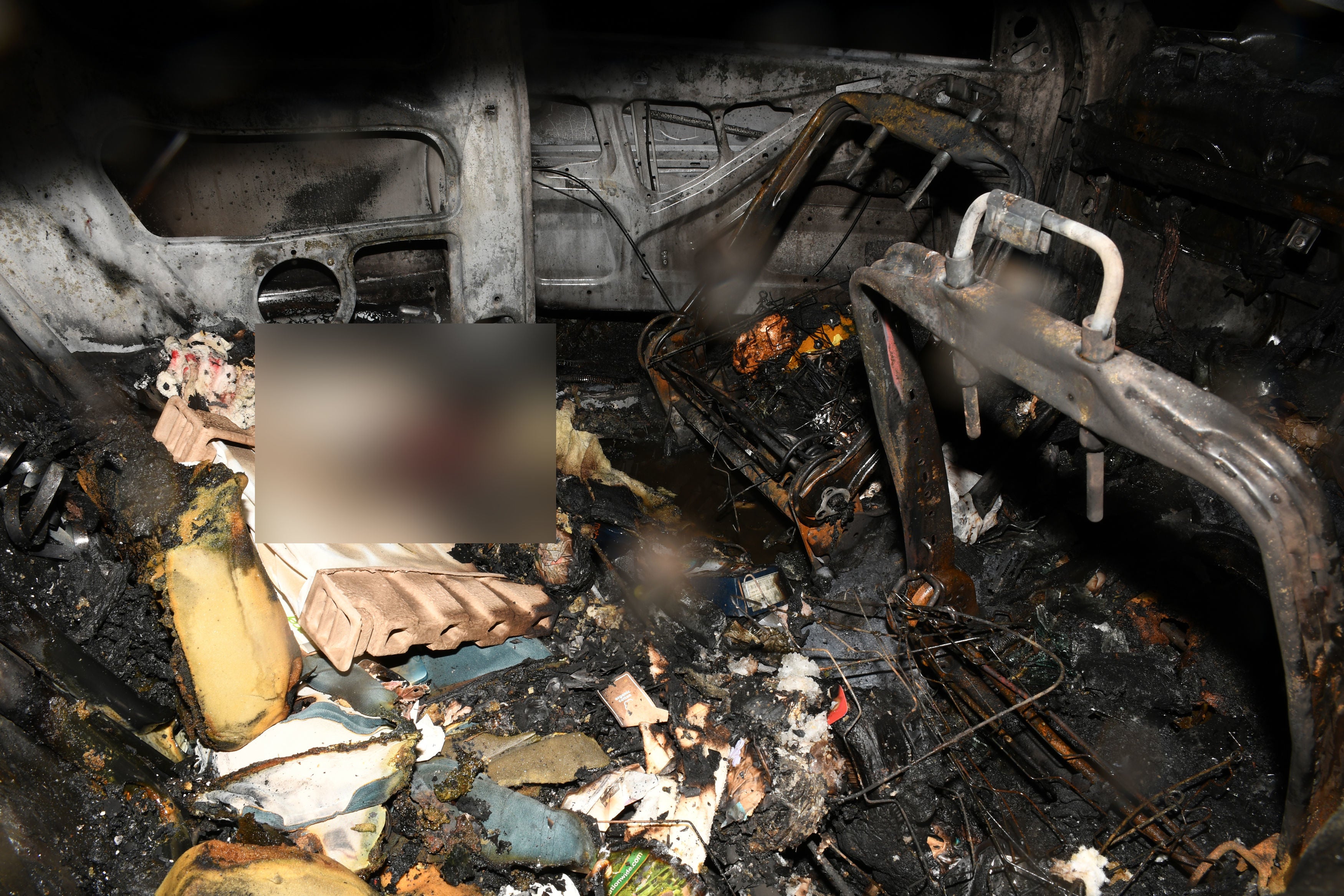 Photos of the inside of the burnt out vehicle were shown to the jury