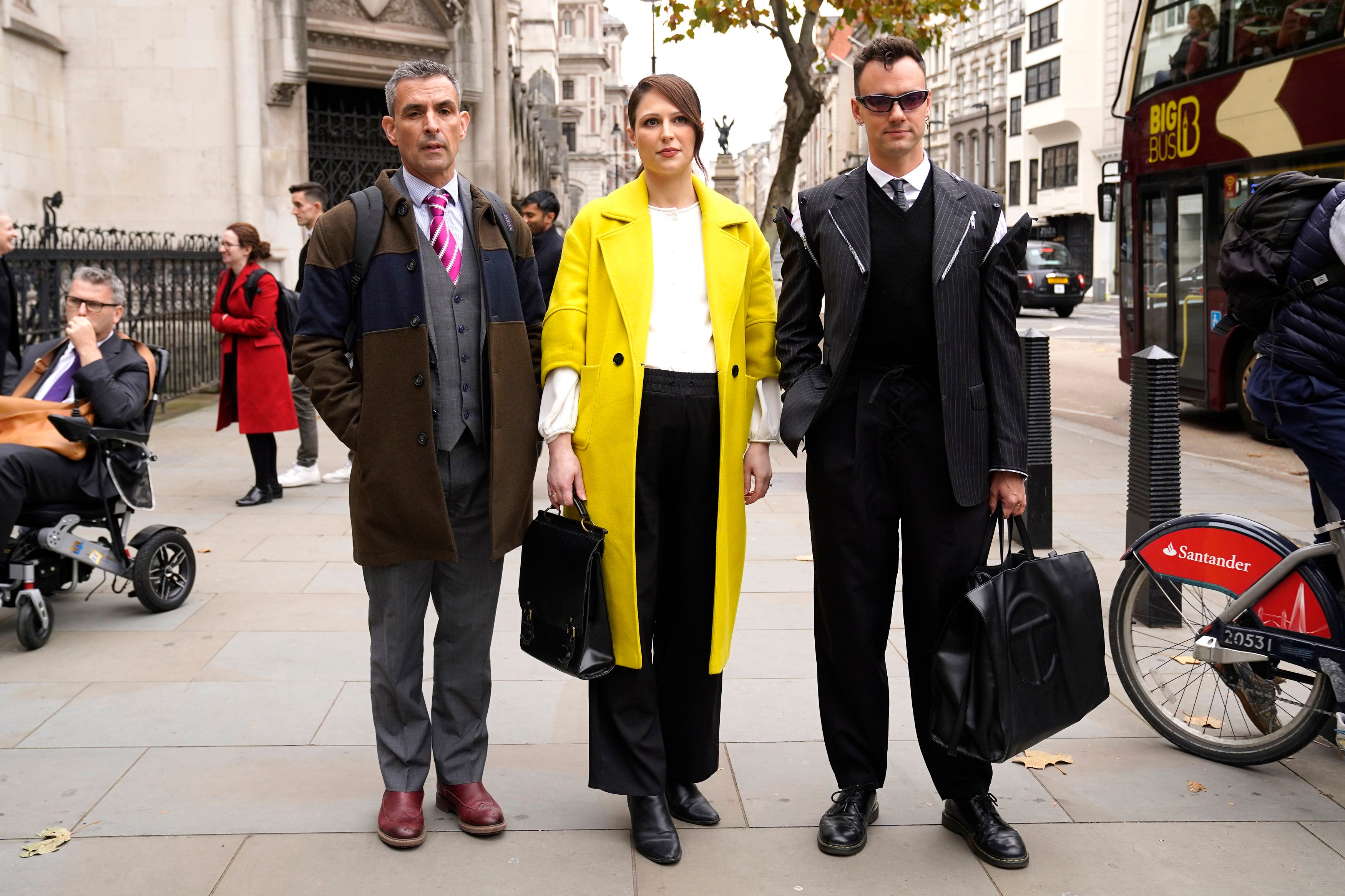 Simon Blake (left), Nicola Thorp and Colin Seymour (right) arriving at the Royal Courts Of Justice