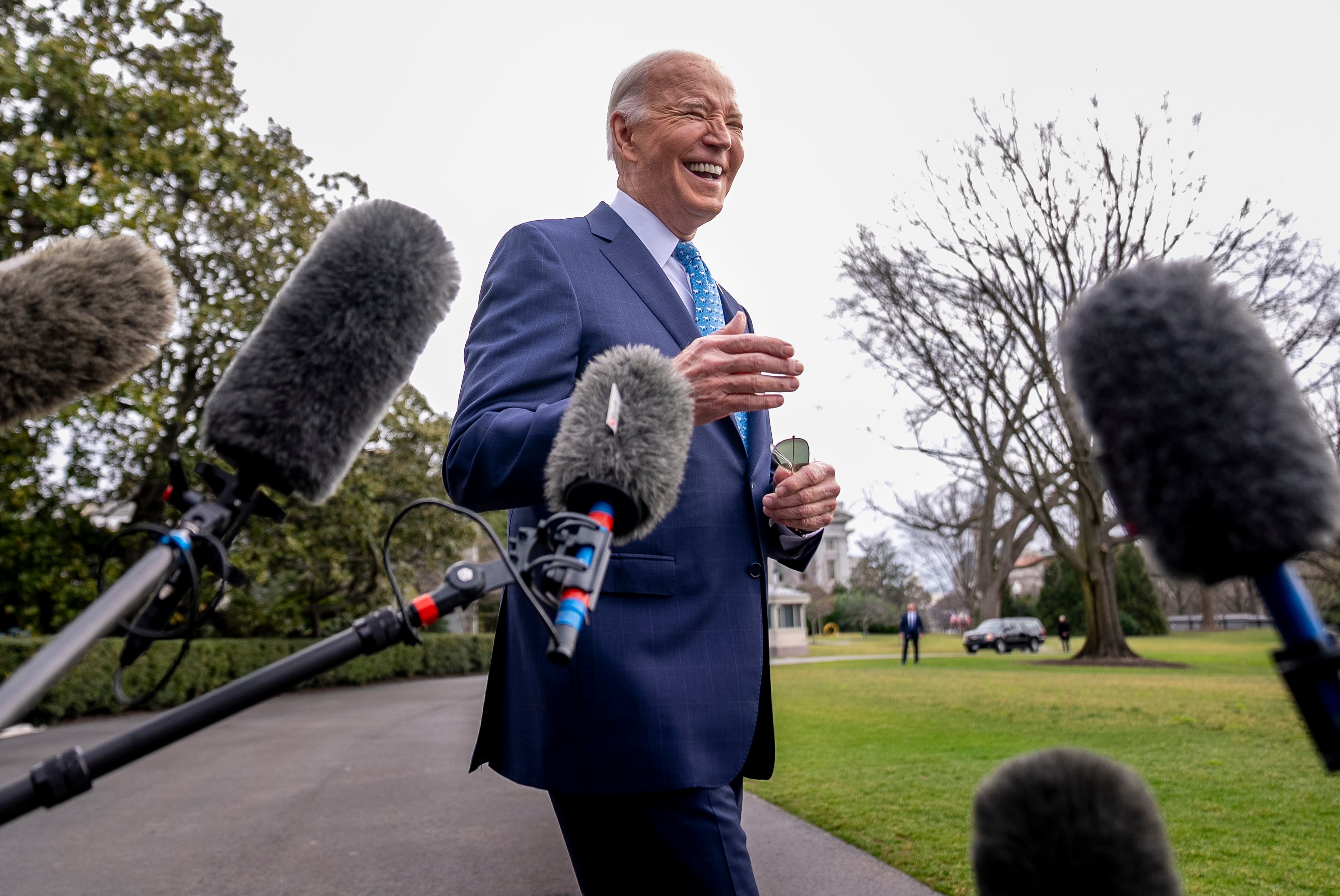 Joe Biden speaks to reporters before leaving the White House on 30 January.