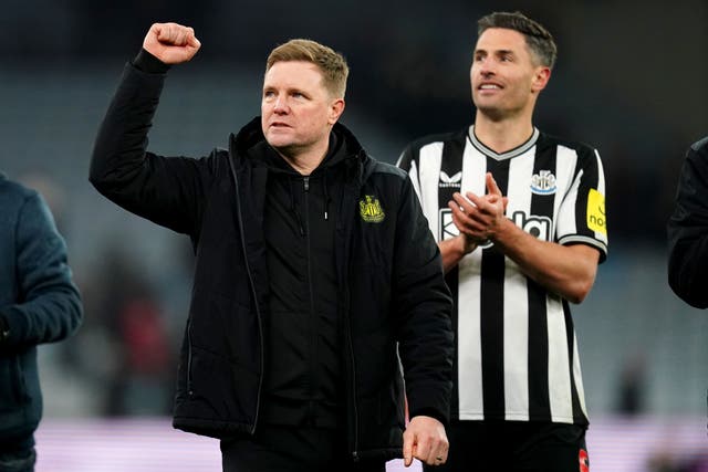 Newcastle manager Eddie Howe, left, and two-goal hero Fabian Schar celebrate victory over Aston Villa (Nick Potts/PA)