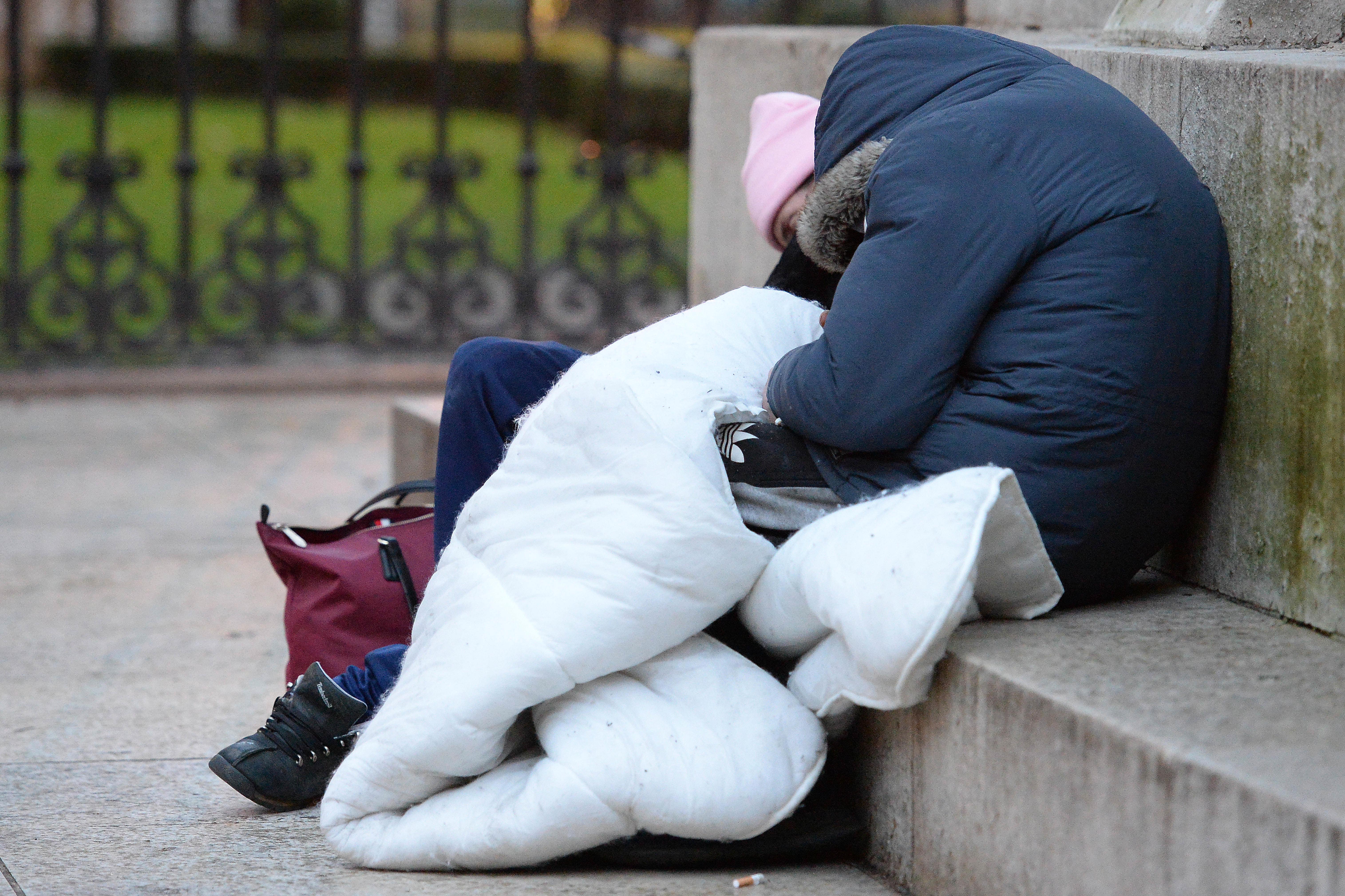 Homeless people sleep on the plinth of the Ferdinand Foch equestrian statue in Victoria, London (Nick Ansell/PA)