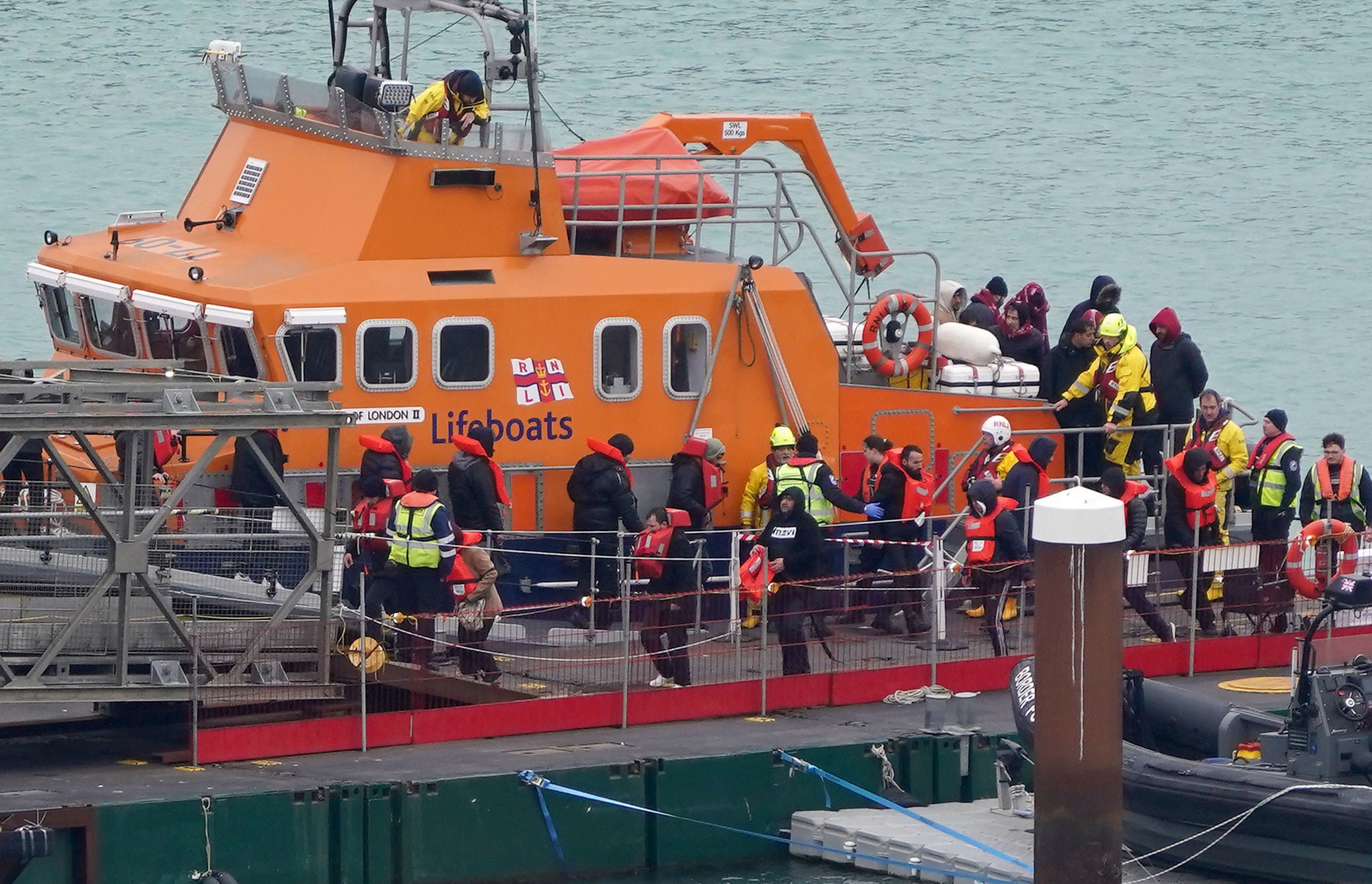 A group of people thought to be migrants are brought in to Dover, Kent, from the RNLI Dover Lifeboat following a small boat incident in the Channel on 31 January 2024.