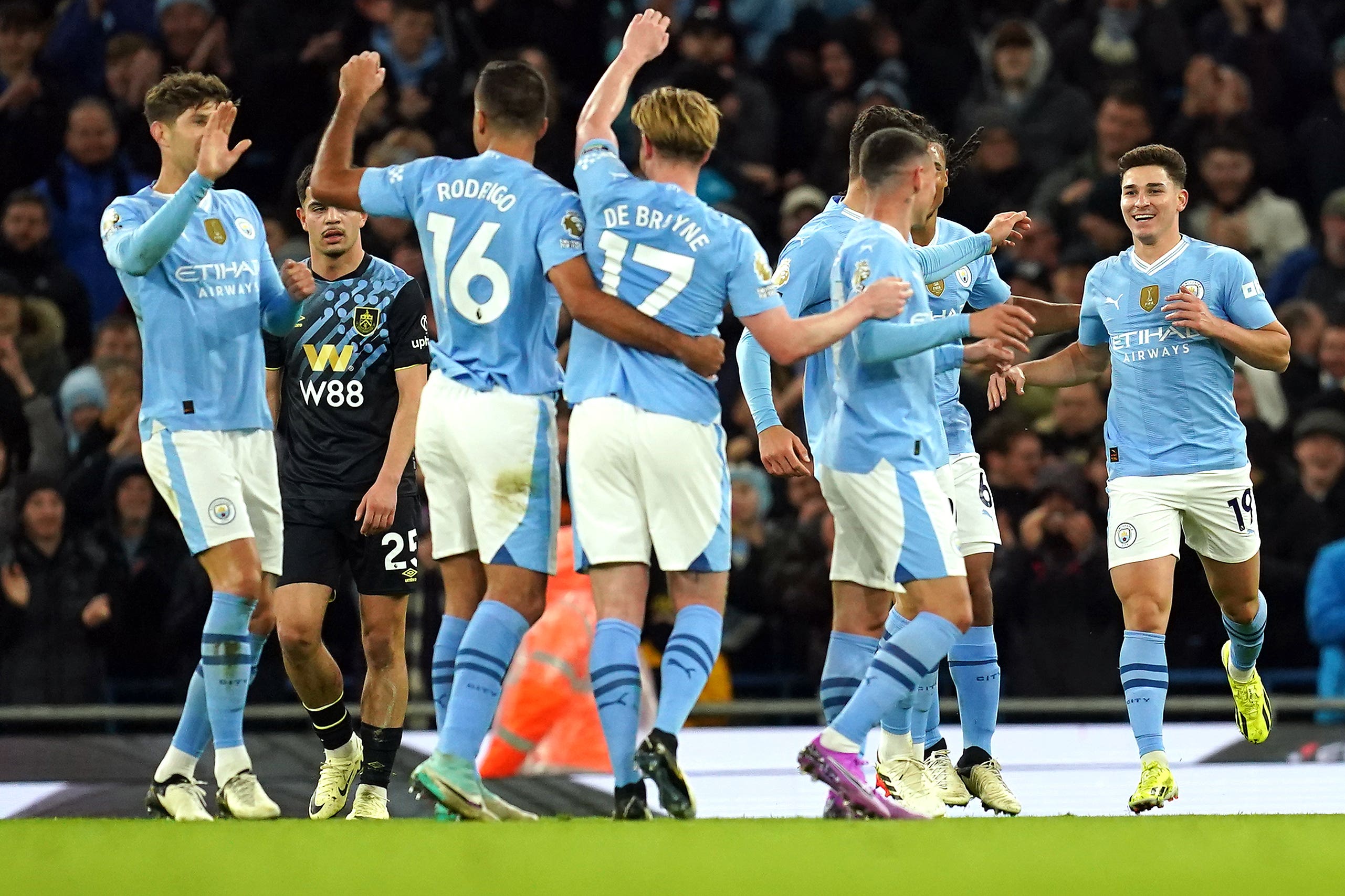 Julian Alvarez (right) celebrates his second (Martin Rickett/PA)