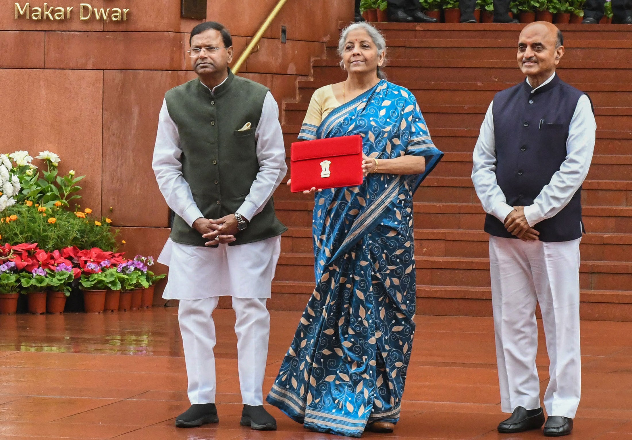 India’s Finance Minister Nirmala Sitharaman holds up the file containing the country’s interim budget 2024