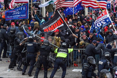 Trump supporters clash with police and security forces as they storm the US Capitol in Washington, DC on January 6, 2021