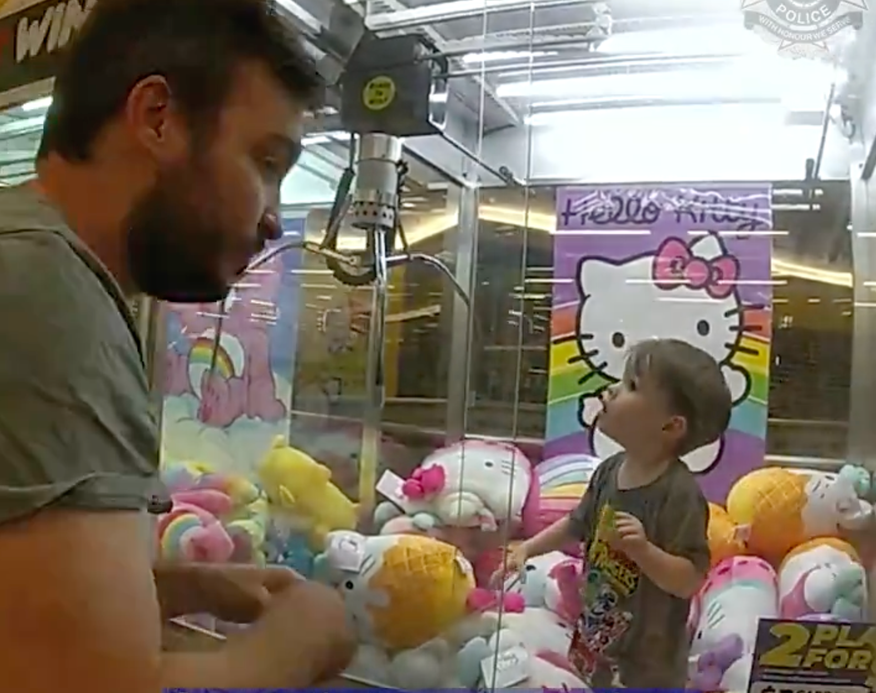 Surrounded by Hello Kitty soft toys, the boy didn’t appear to be as distressed or in any rush to be rescued as his parents and officers devised a plan to get him out of the claw machine