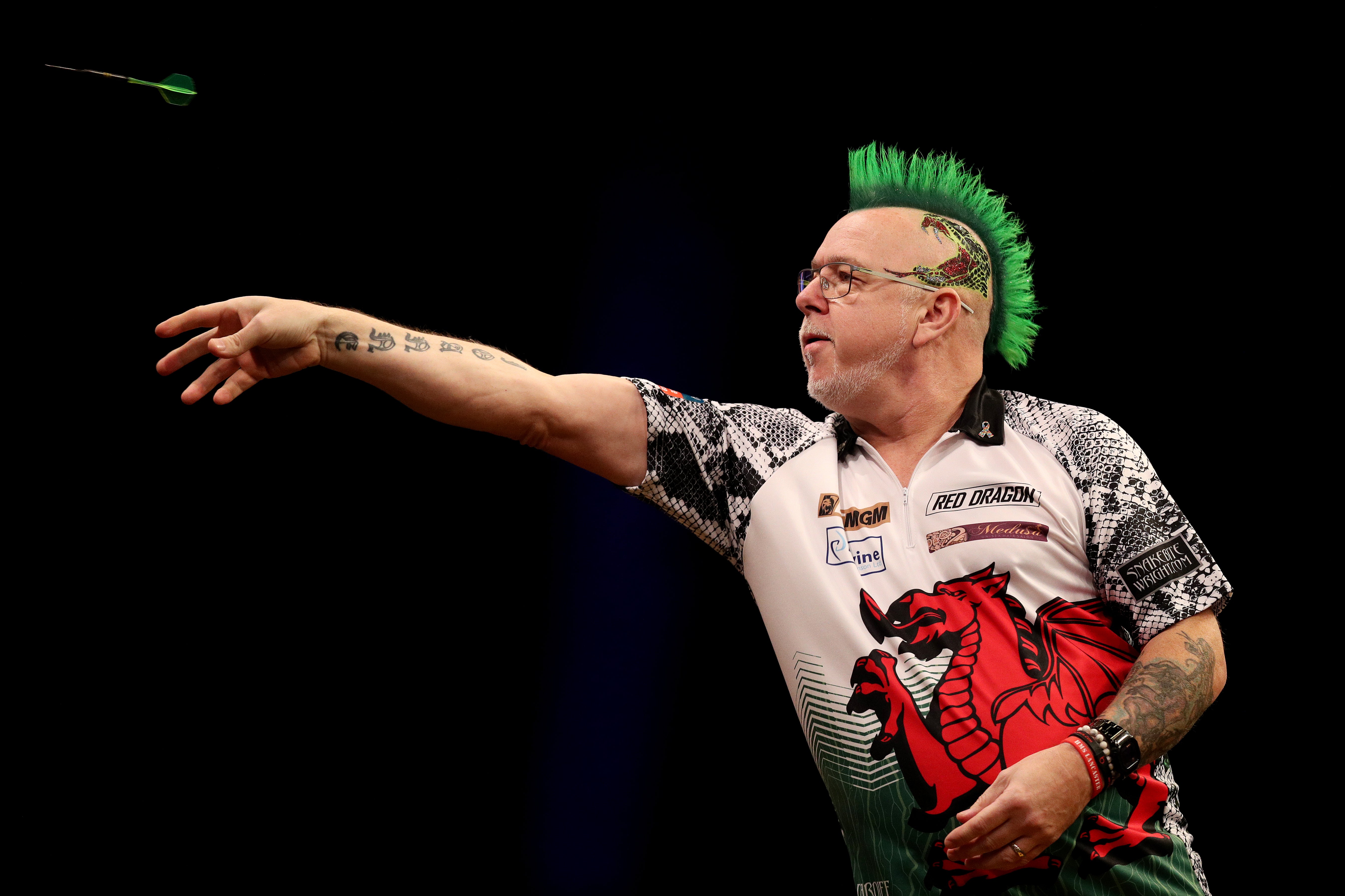 Peter Wright in action on stage in Cardiff