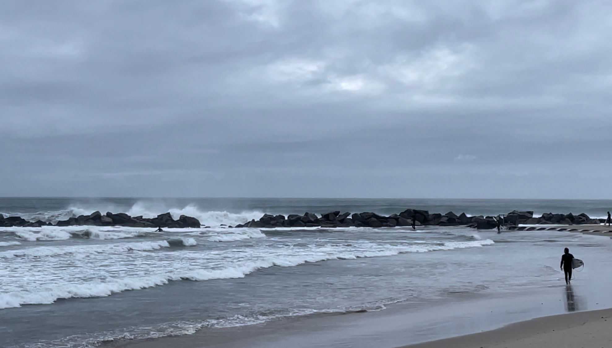 Surfers brave conditions of the Pineapple Express storm in Venice Beach