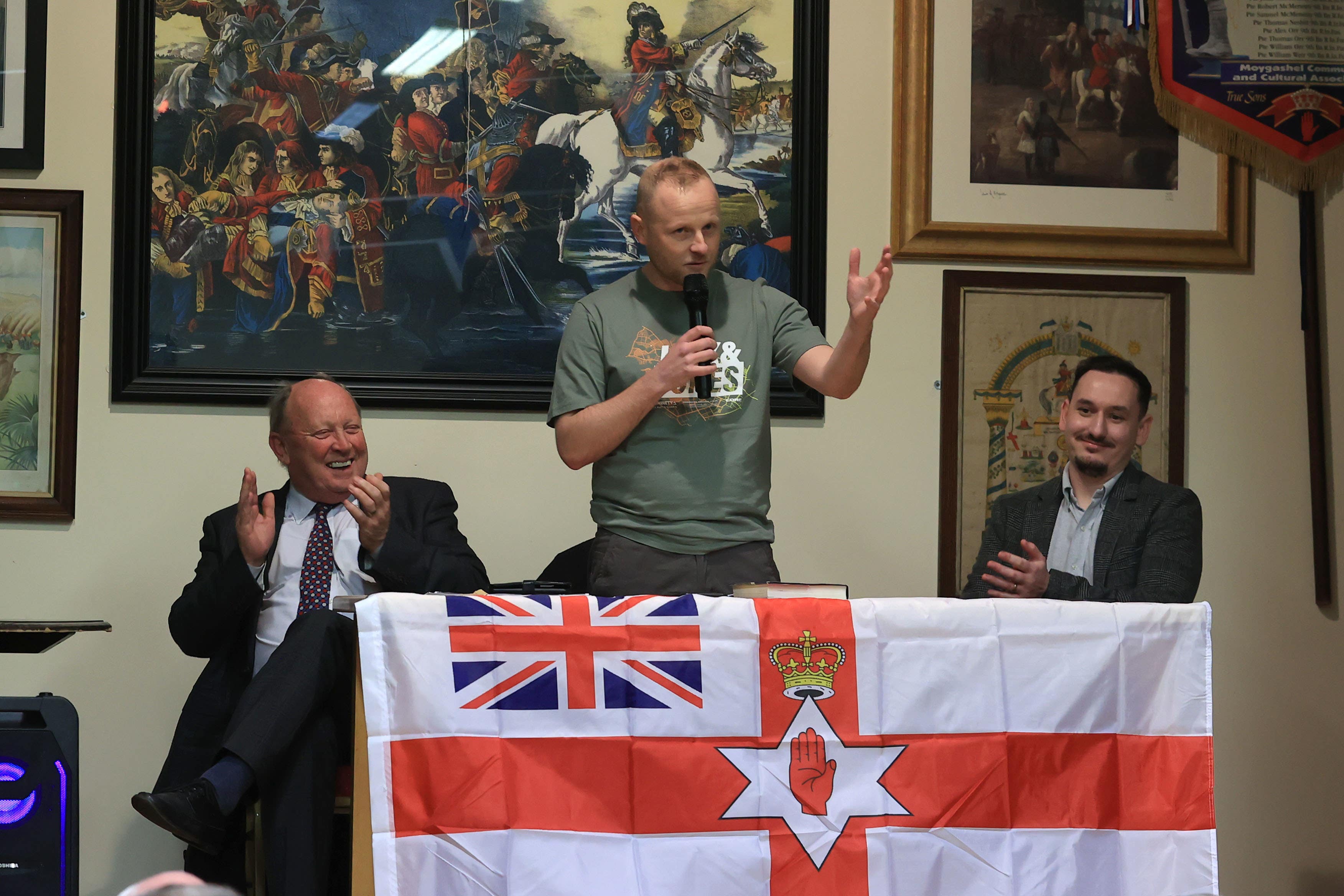 Jamie Bryson addresses the public meeting (Liam McBurney/PA)