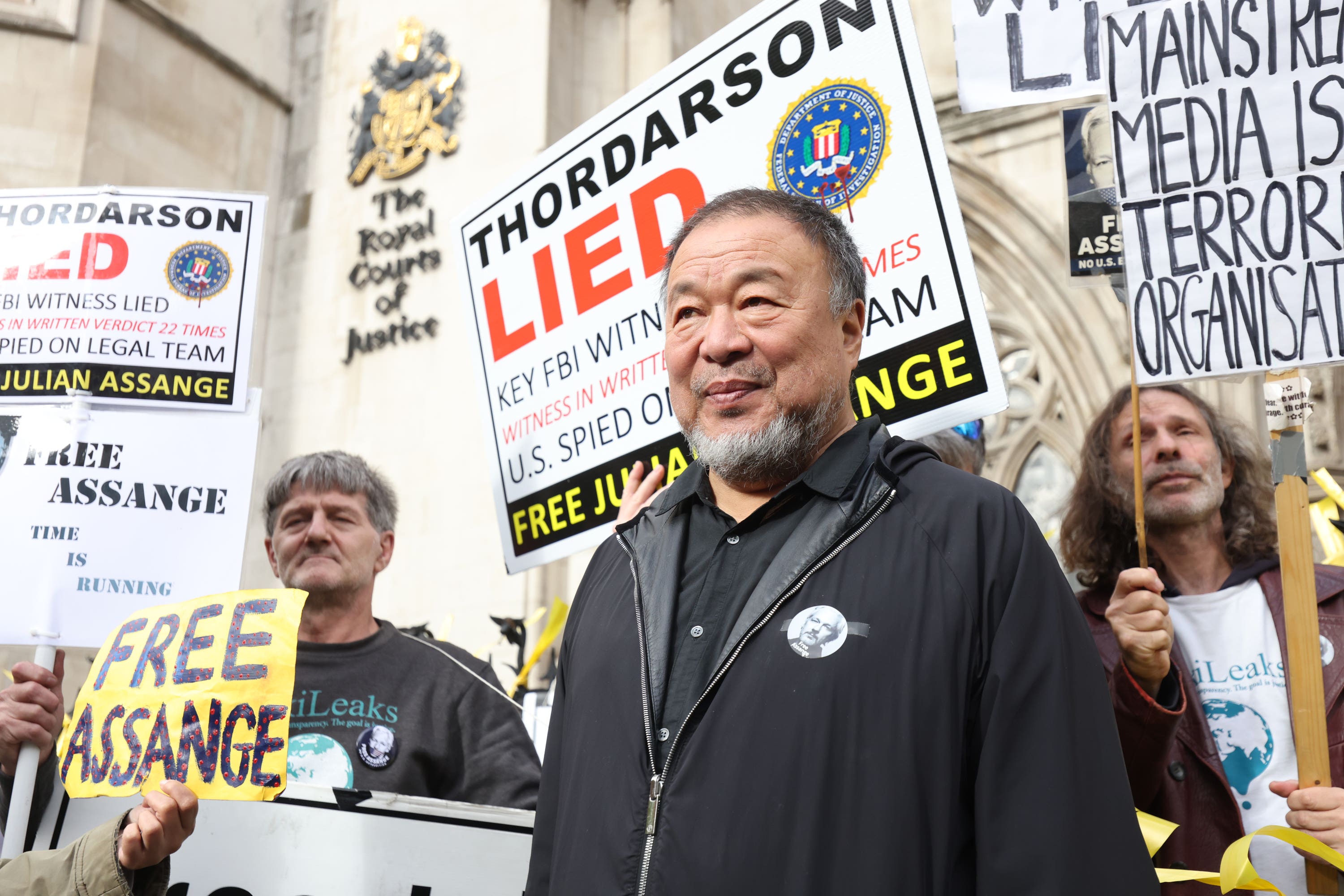 Ai Weiwei joins a protest supporting Julian Assange, as the artist speaks out on censorship (James Manning/PA Wire)