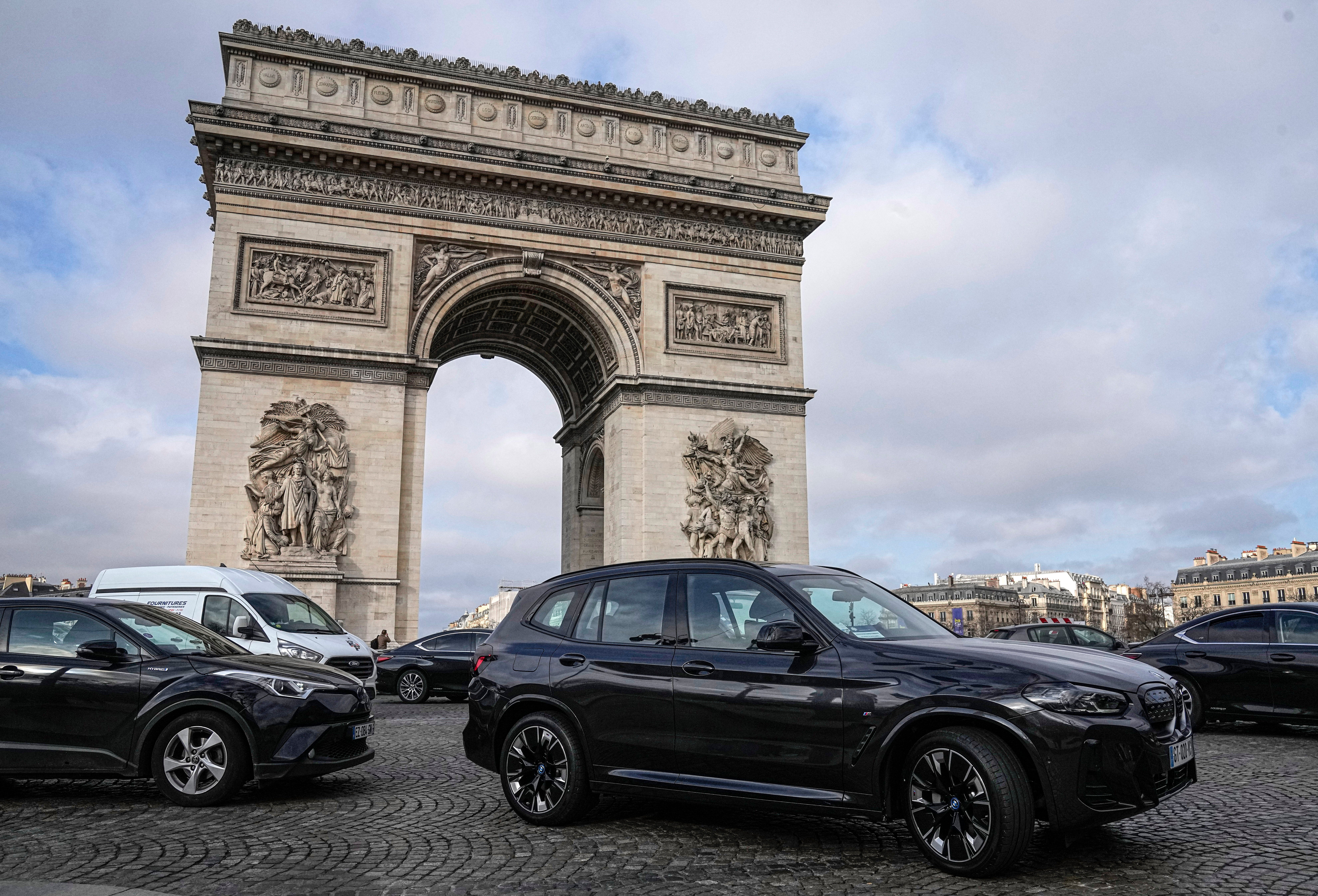 Cars by the Arc de Triomphe in Paris