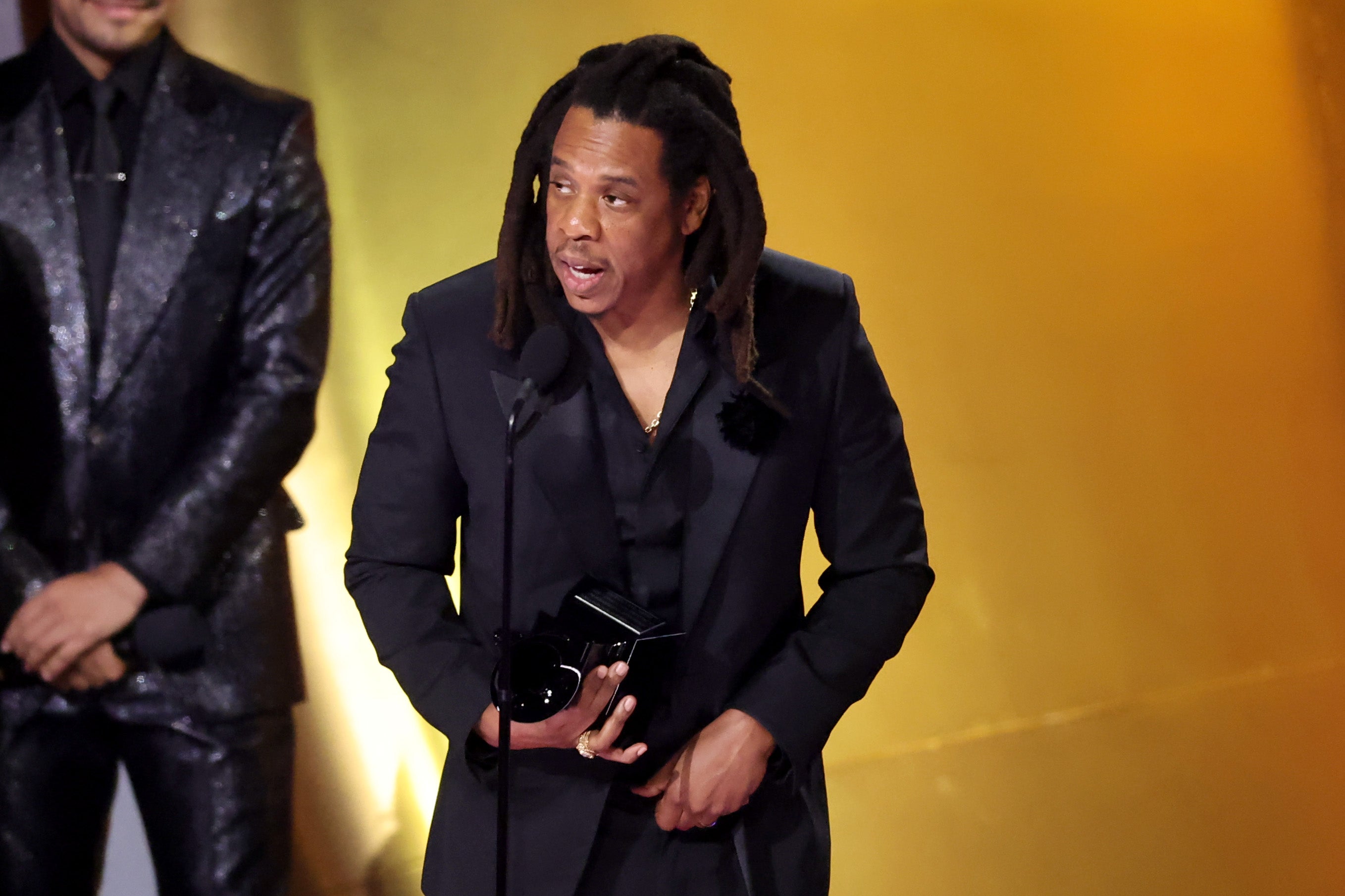 Jay-Z accepting the Global Impact Award onstage during 2024 Grammy Awards